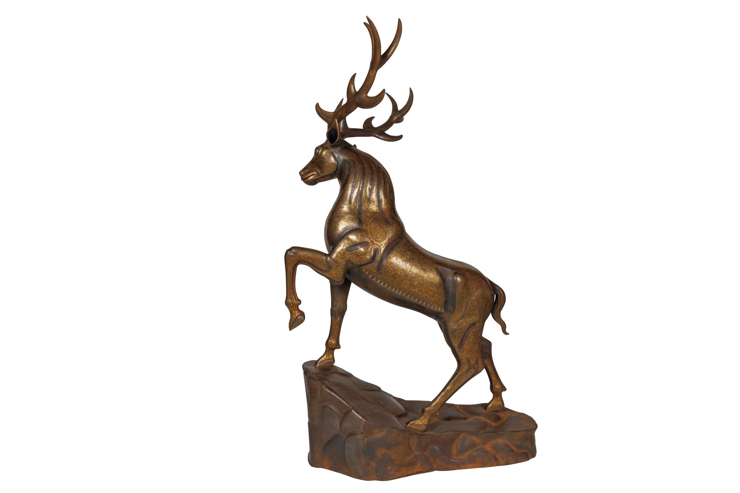 An Exceptional Life-Size Middle Eastern Gold-Inlaid Steel Deer Sculpture

This extraordinary life-size Middle Eastern deer sculpture exemplifies the pinnacle of artistic craftsmanship, rendered in steel and adorned with intricate gold inlay