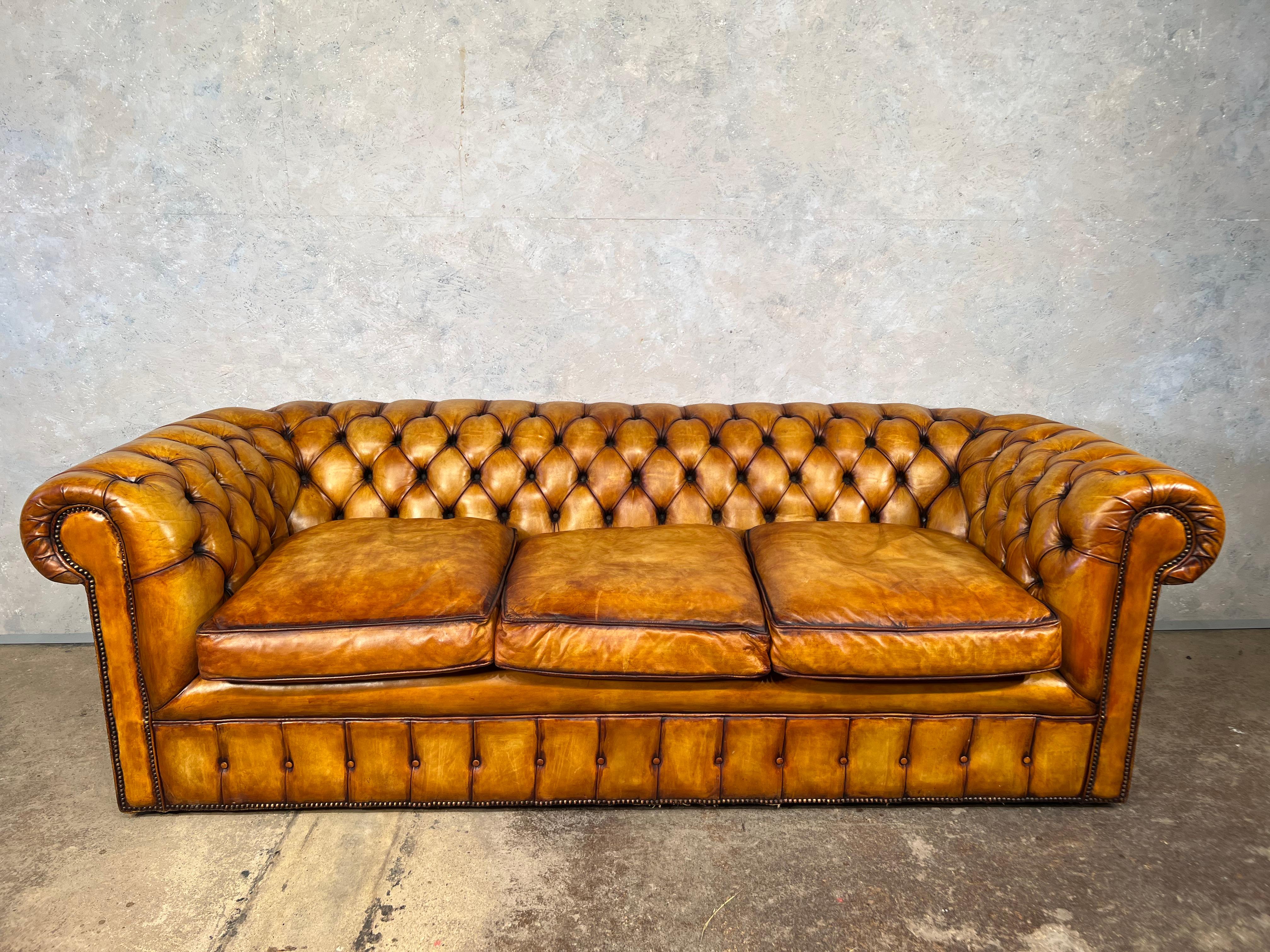 An exceptional mid-century leather chesterfield, a great size, being long and deep in proportions, Great quality leather, very supple and soft, the cushions are feather filled for extra comfort.

In excellent condition, Hand dyed with a beautiful