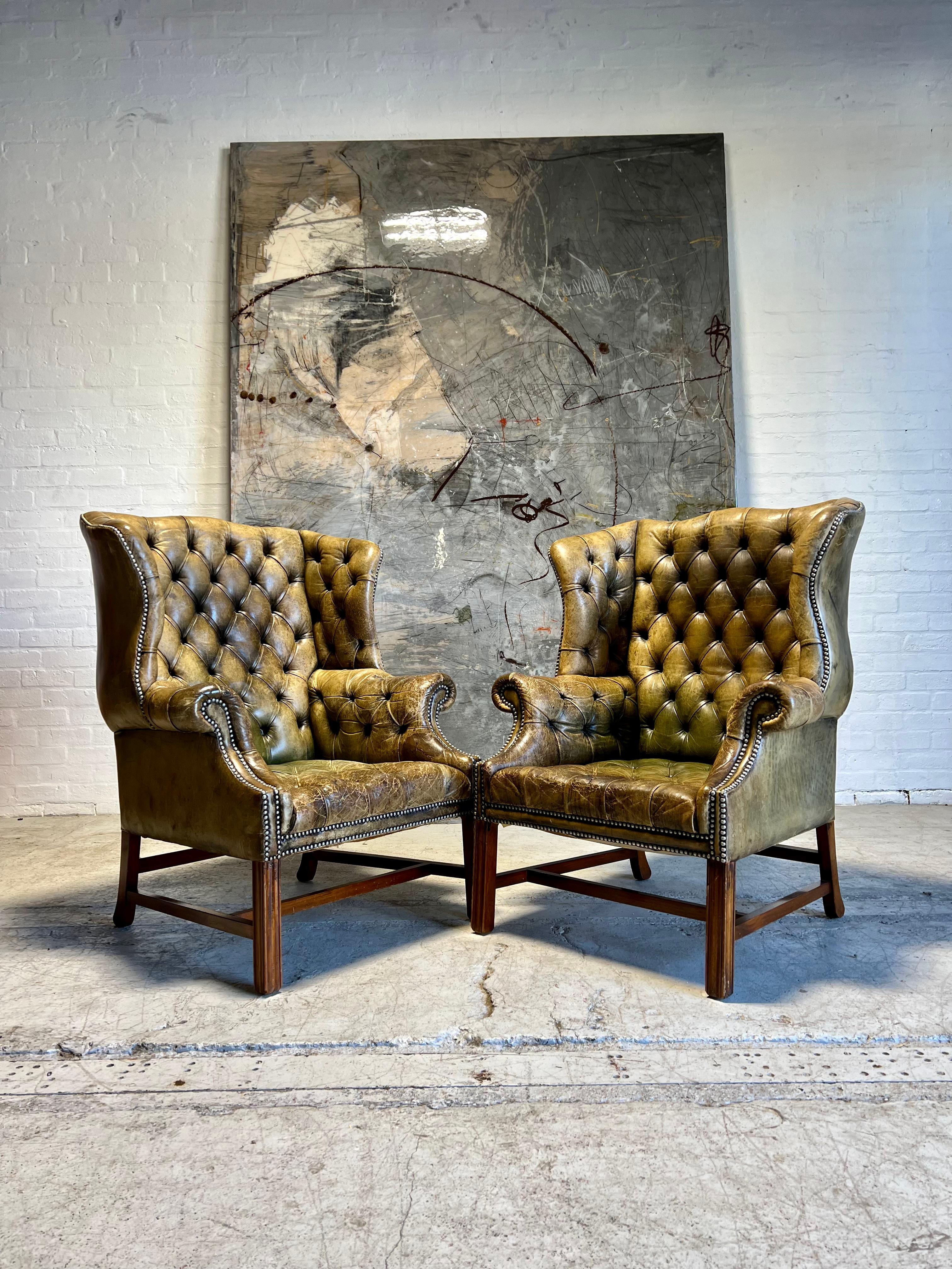 British Exceptional Pair of MidC Chesterfield Wing Back Chairs in Original Leather For Sale