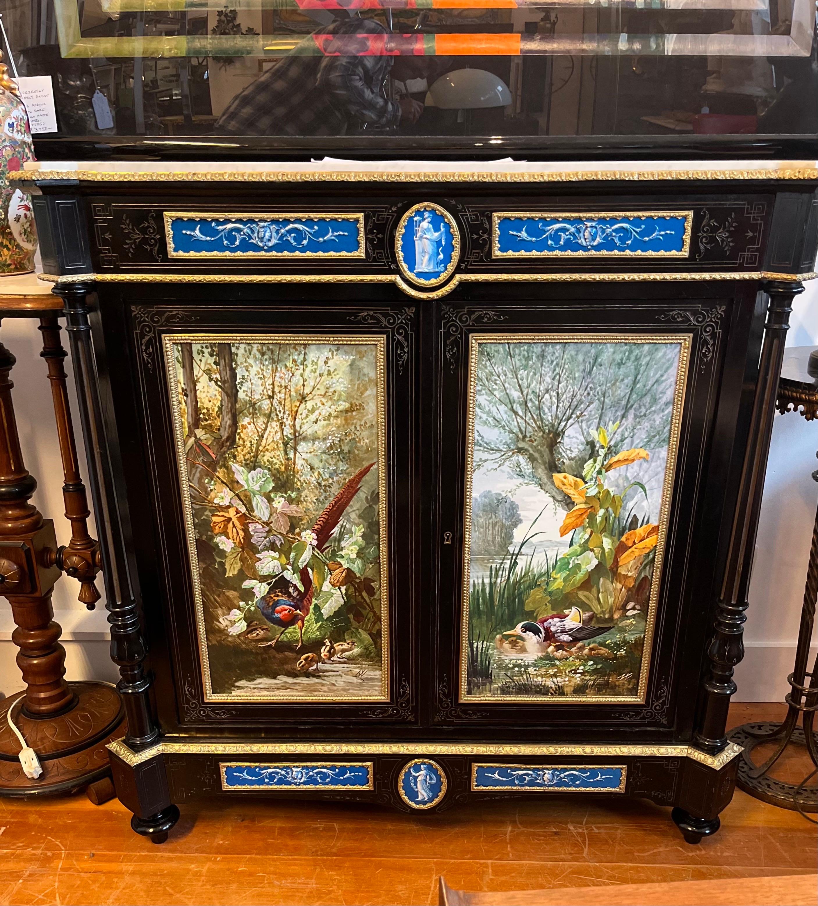 An Exceptional Napoleon III cabinet with Sevres porcelain hand painted plaques by Narcisse Vivien. The cabinet by Famed architect cabinet maker and interior designer, Leon Marcotte.  This piece was at the 1878 Paris Exposition and was featured on