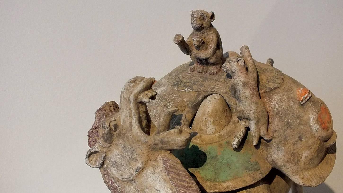 Tang Exceptional Painted Pottery Figural Group of a Bactrian Camel