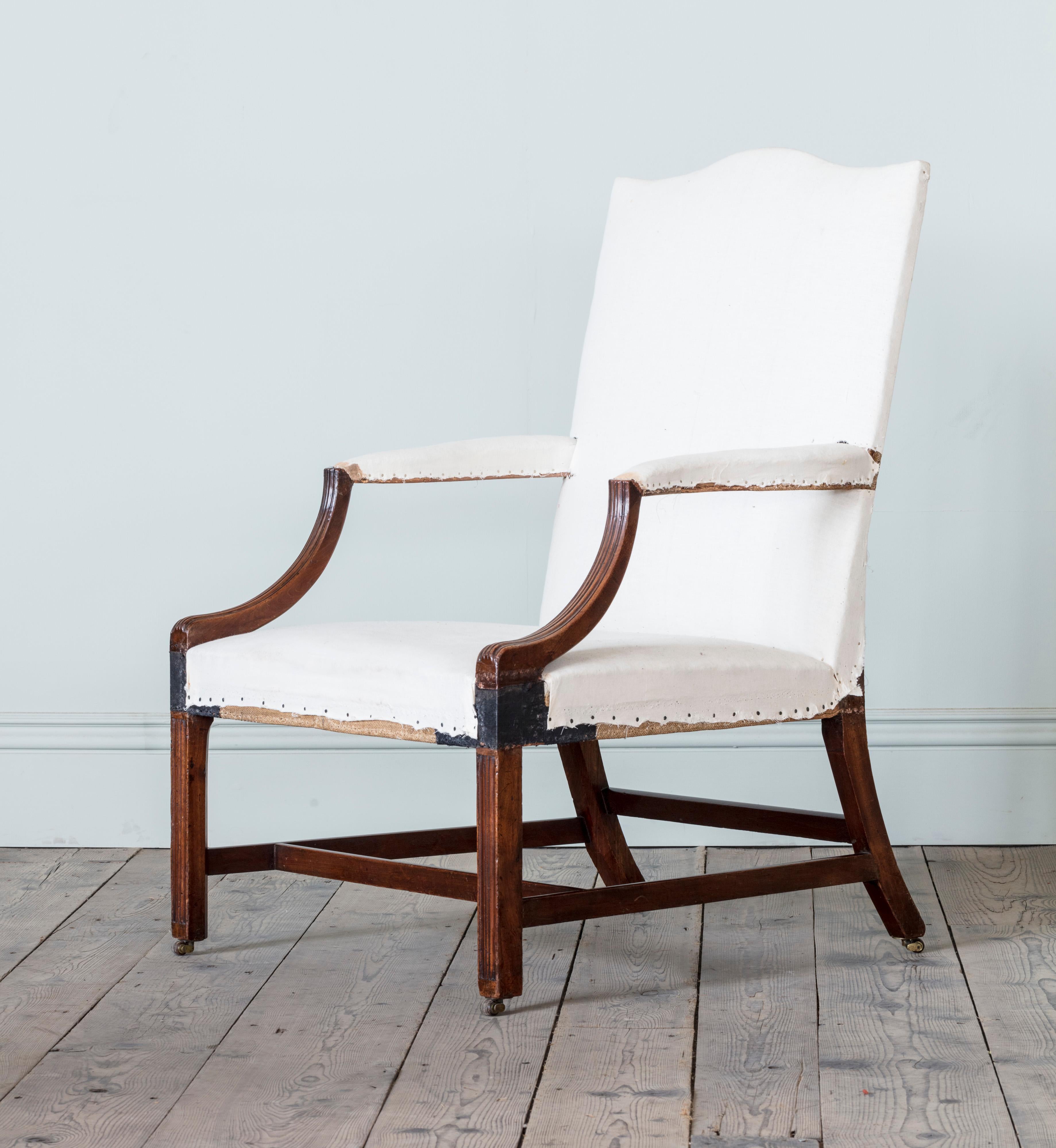 With beautifully drawn line and generous scale, with superb quality timber, and crisply incised channel mouldings to the front legs and raised mouldings to the swept show wood arm supports.
The chairs are offered in lovely condition with original