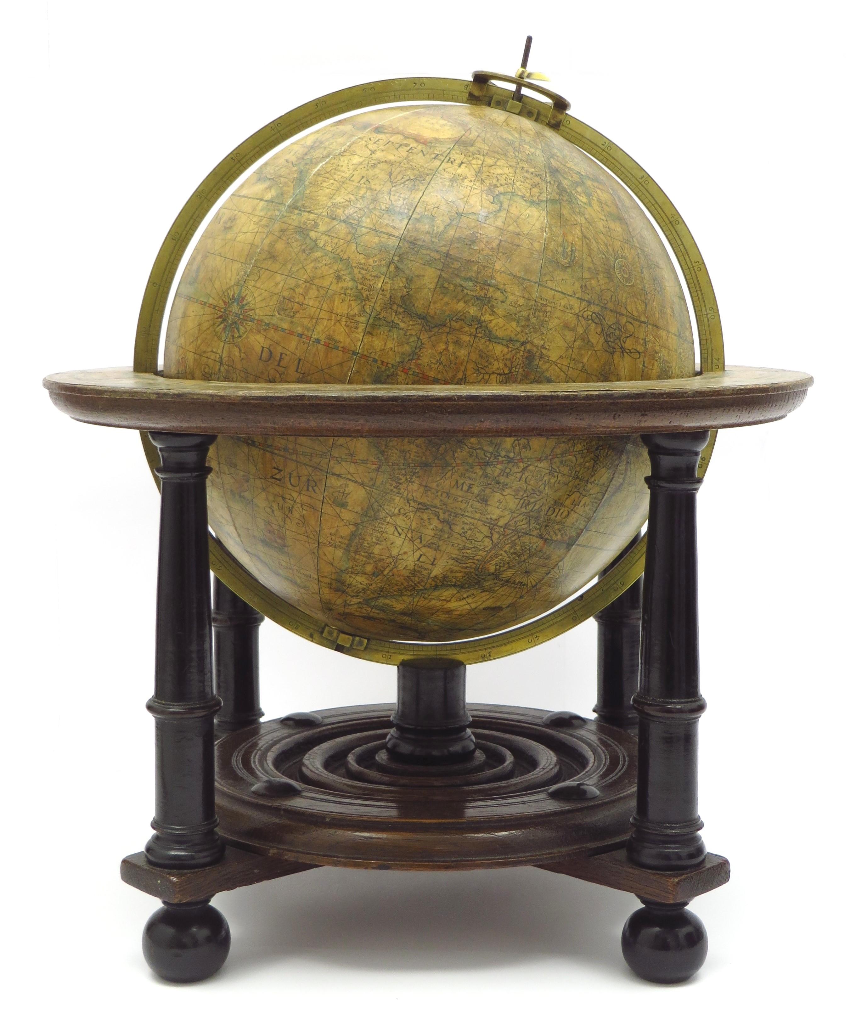 A very rare set of globes, 9 inch / 23cm, with an overall height of 38 cm, Amsterdam, dated 1602, but published after 1621. In their original stands with circular wooden horizon rings, covered with printed paper, supported by four legs and brass