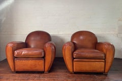 An Exceptional Pair of French Leather Club Chairs Cuban Round Models Circa 1950