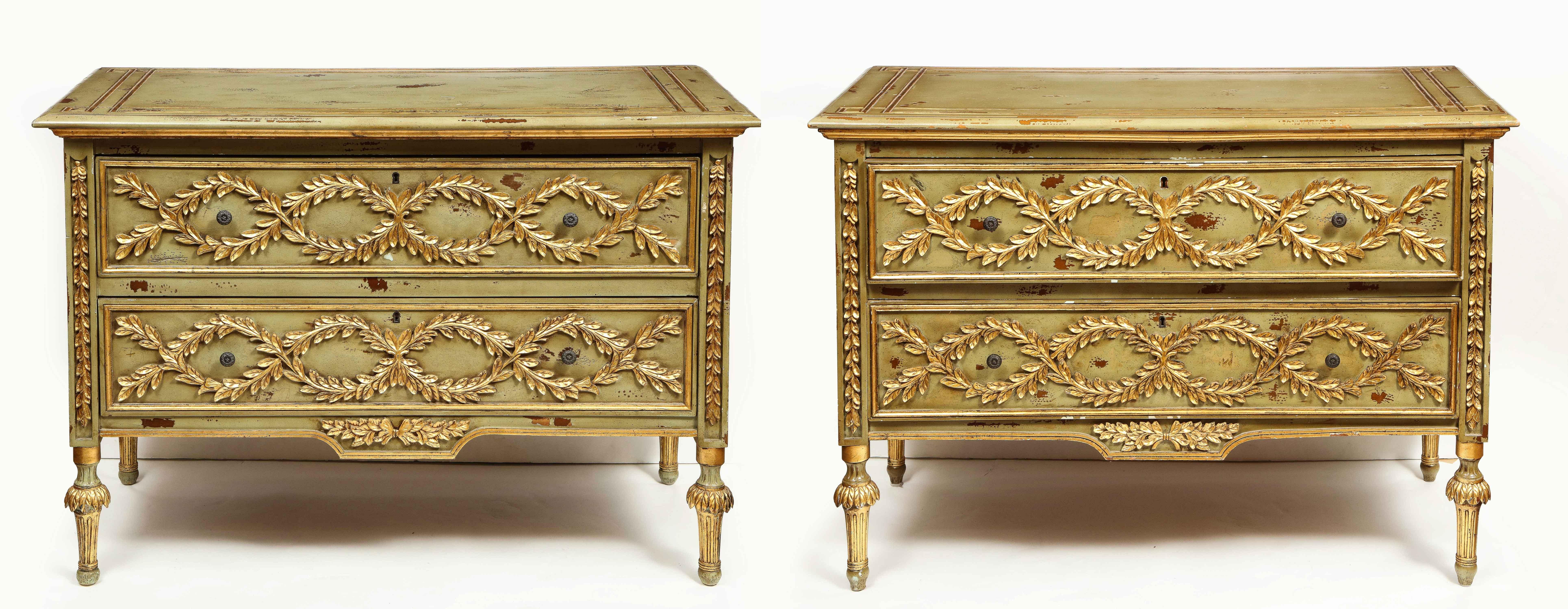 An exceptional pair of French Provincial green painted and parcel-gilt commodes, circa 19th century.

Excellent quality and design. Very decorative and stable.

Two drawer chest/commode with antiqued distressed olive green painted finish and