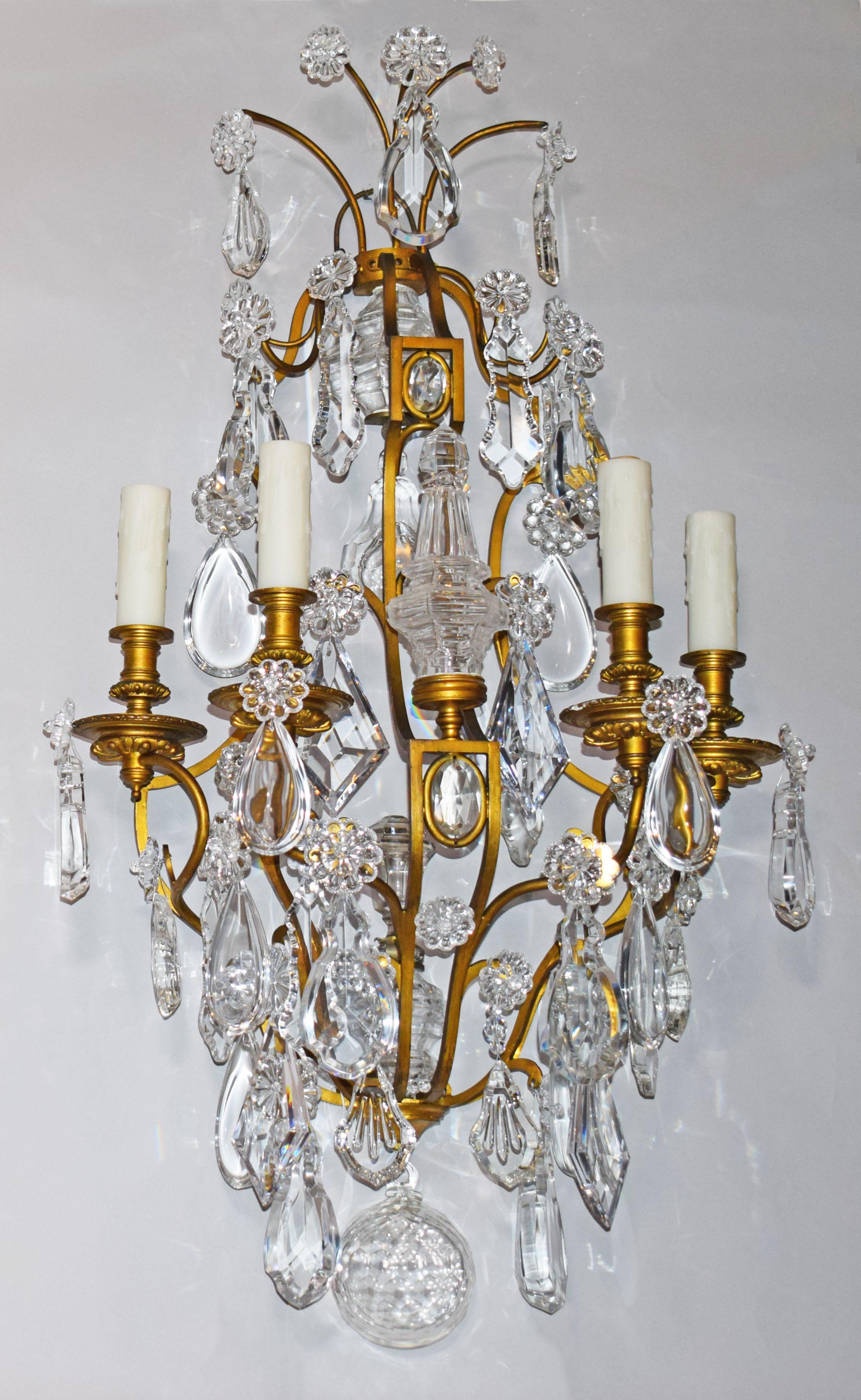 An exceptional pair of gilt bronze & crystal wall sconces by Baccarat. France, circa 1900. 4 lights each.
Dimensions: Height: 35