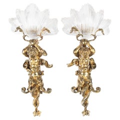 Antique An Exceptional Pair of Ormolu and Glass Triton Wall Lights by Lerolle of Paris