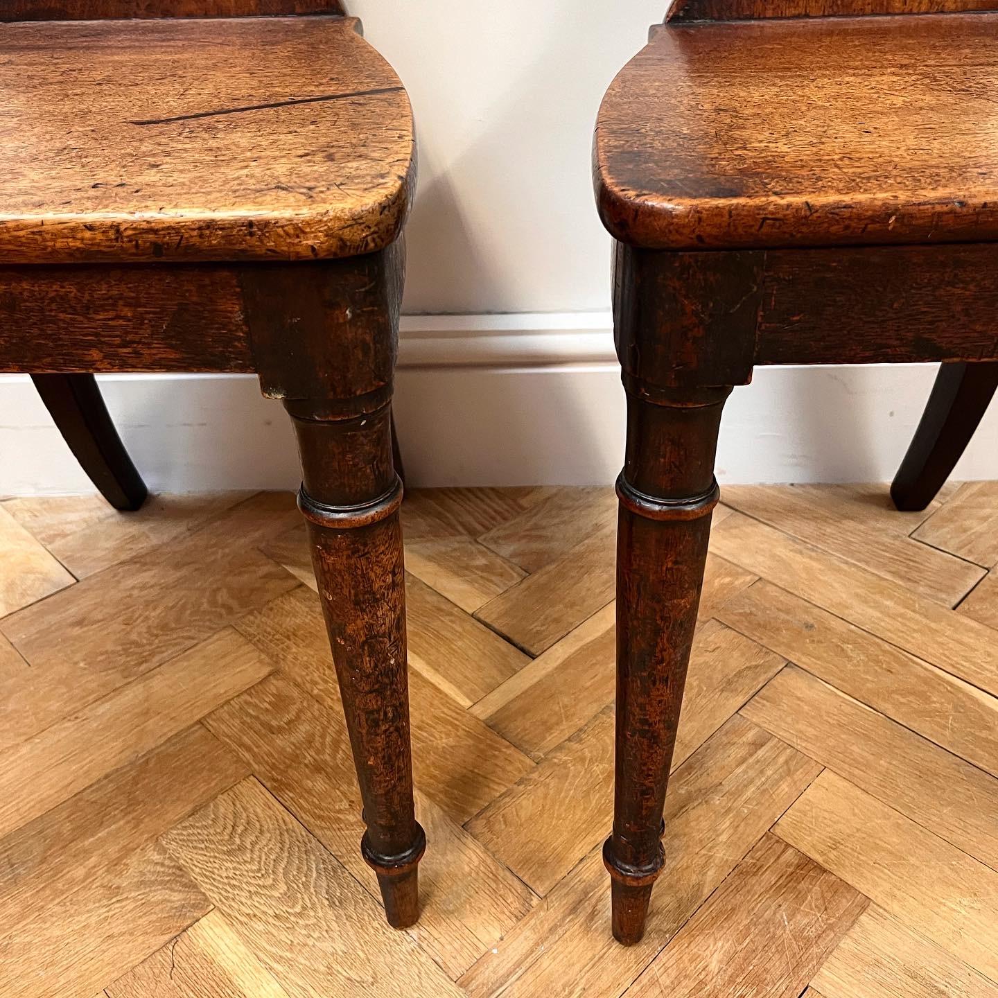 Hand-Painted Exceptional Pair of Regency Mahogany Hall Chairs For Sale