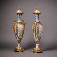 An Exceptional Pair of Sèvres Style Iridescent-Ground Porcelain Vases and Covers