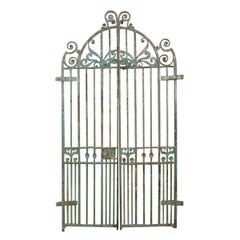 An exceptional period pair of Arts & Crafts hand hammered & wrought iron gates