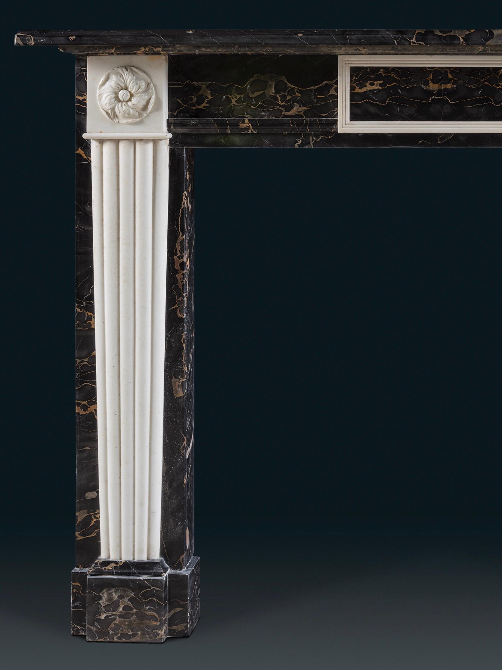 English An Exceptional Regency Style Chimneypiece in Portoro Nero & Statuary Marbles For Sale
