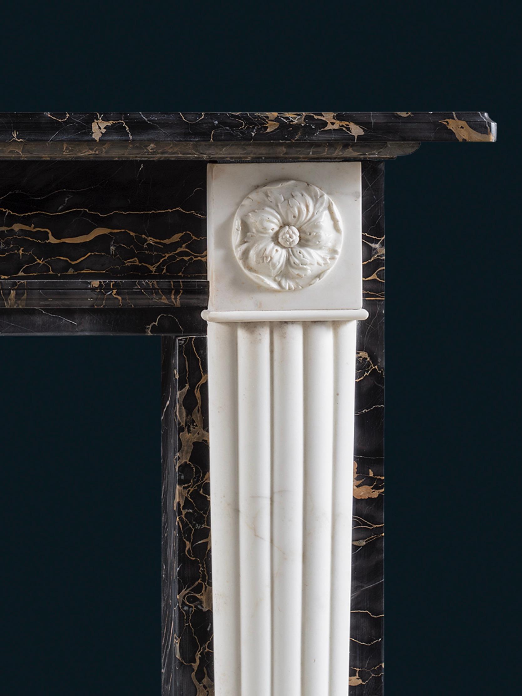 An Exceptional Regency Style Chimneypiece in Portoro Nero & Statuary Marbles In Good Condition For Sale In London, GB