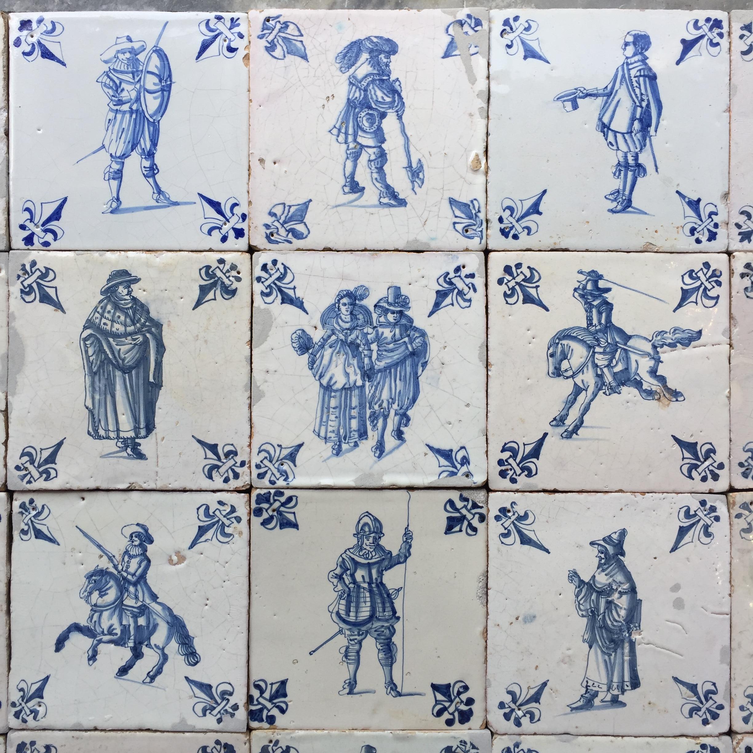 An exceptional set of 20 blue and white Dutch Delft tiles with figures from daily life.
Made in Amsterdam, The Netherlands.
Circa 1620 - 1640.

This set of tiles is of very fine quality and has a bright glaze, characteristic for the Amsterdam