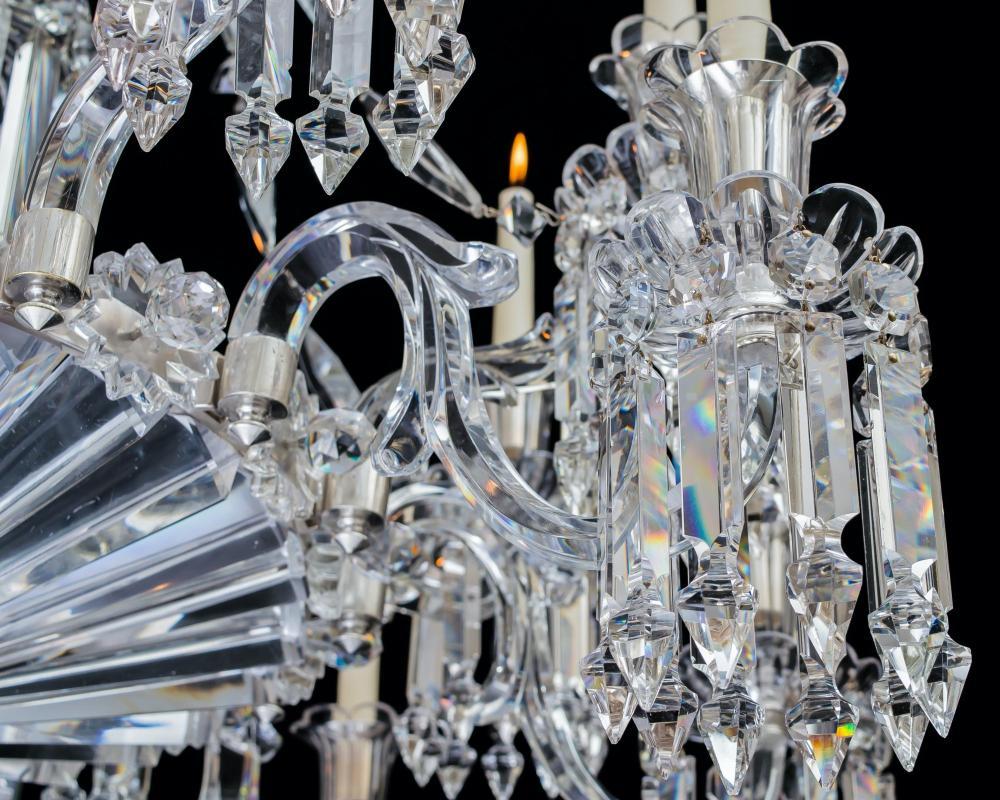 A fine quality Victorian silver mounted chandelier attributed to F&C Osler, the stem with graduated drop hung dishes cascading down from the top canopy, the main frame, issuing sixteen six sided leaf cut arms supporting drop hung scalloped edge drip