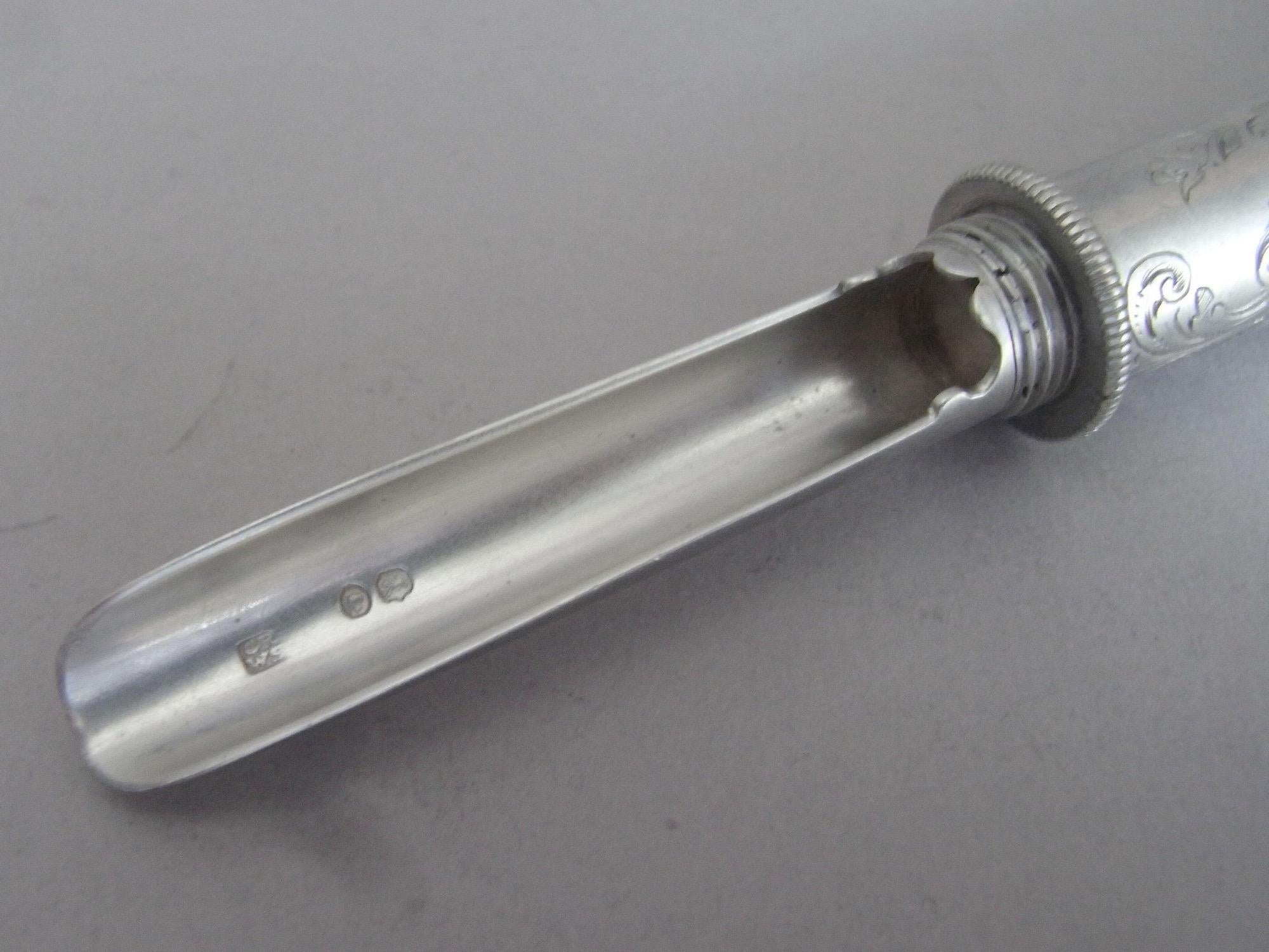 An Exceptionally Fine Apple Corer Made in London in 1845 by Rawlings & Summers.

The Apple Corer has a tubular,shaped, handle beautifully engraved with foliate scrolls and flower heads. The side is also engraved with a Rococo style scroll cartouche
