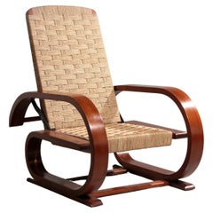 An exceptionally rare mahogany recliner crafted in Italy during the 1950s"