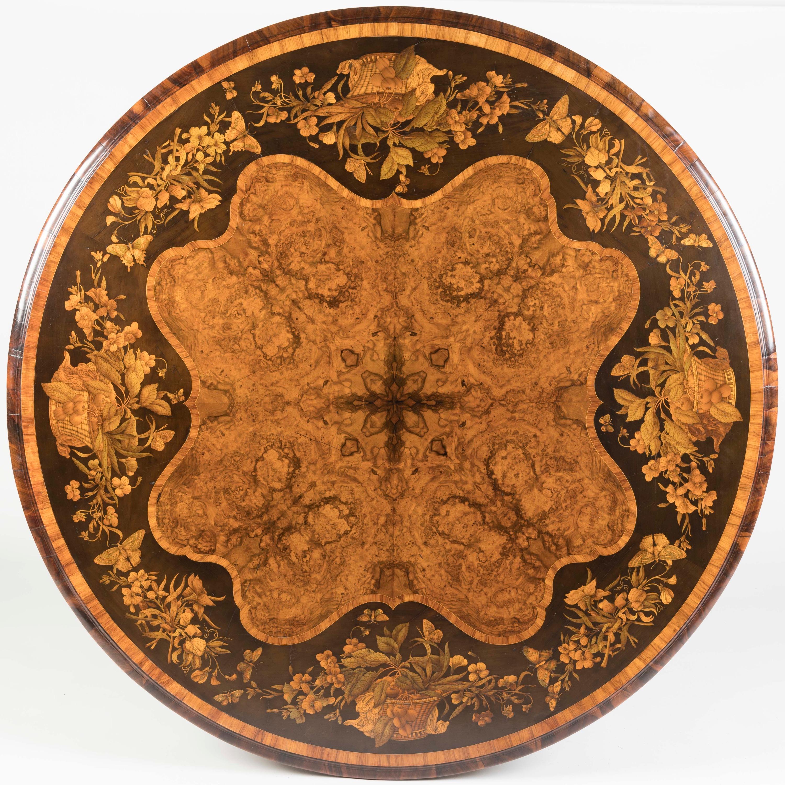 An Exhibition-Quality Burr Walnut and Marquetry Centre Table
Designed by Richard Bridgens (1785-1846)

The circular top characterised by a central quarter-veneered field of beautifully figured burr walnut, surrounded by a wide shaped border of