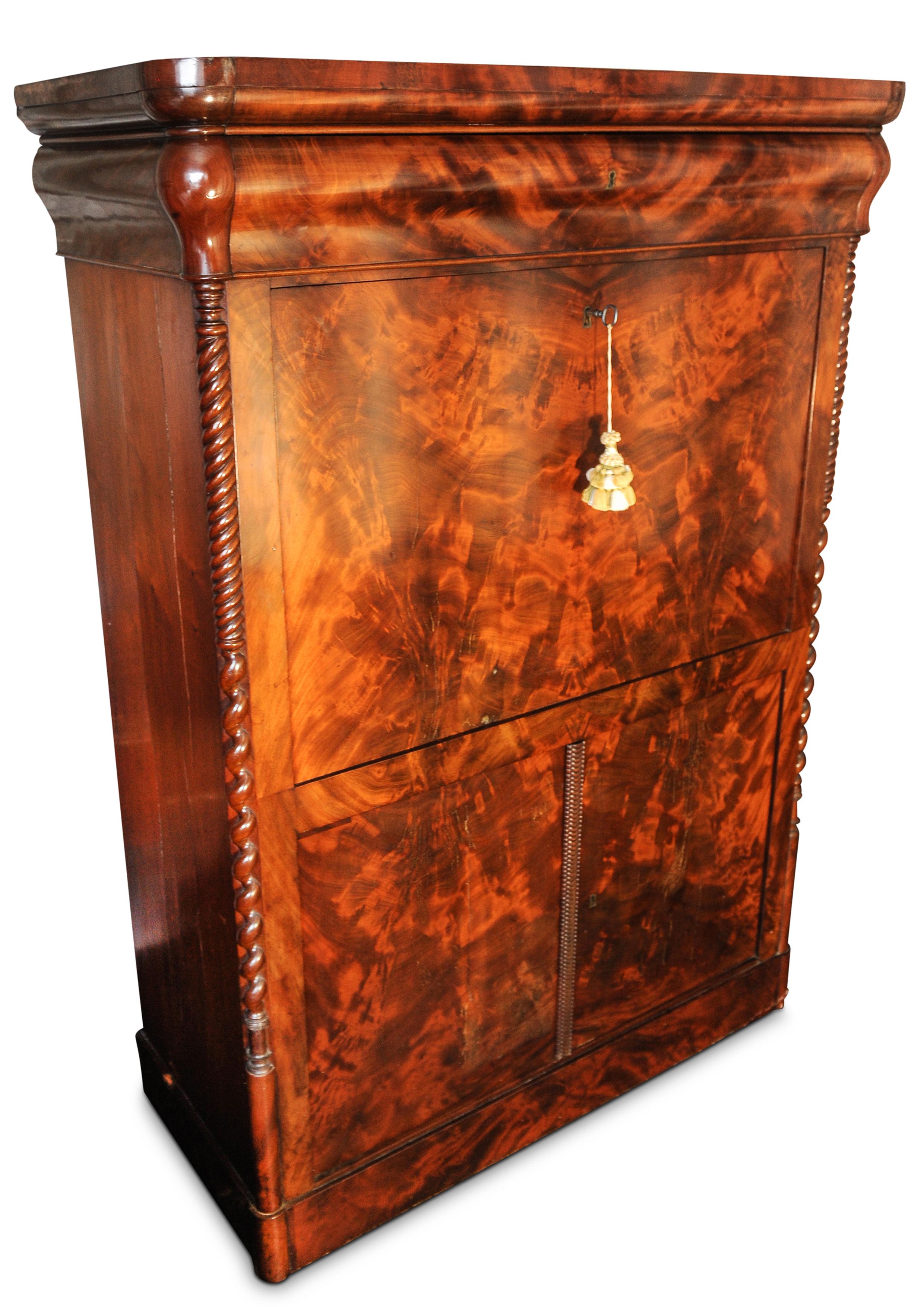 An Exquisite 19th Century French Flame Mahogany Secretaire. 
Complete With Fitted Interior, & Enclosed Shelves, Raised On A Plinth Base.

Item has stunning grain and patina, central secretaries is flanked by two barley-twist columns.

Desk surface