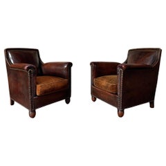 An Exquisite and Rare Pair of French Leather Club Chairs, Circa 1910