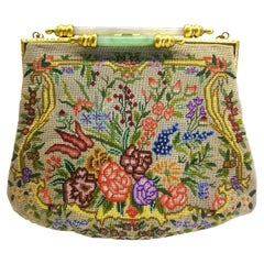 Antique An exquisite Art Deco petit point bag, with a double jade bar clasp, 1920s.