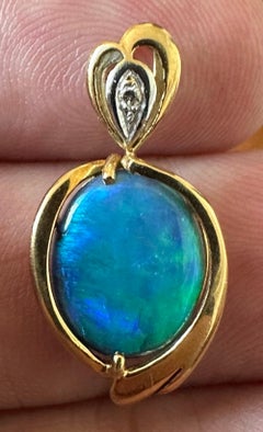 An Exquisite Australian Black Opal & Diamond 18k Pendant