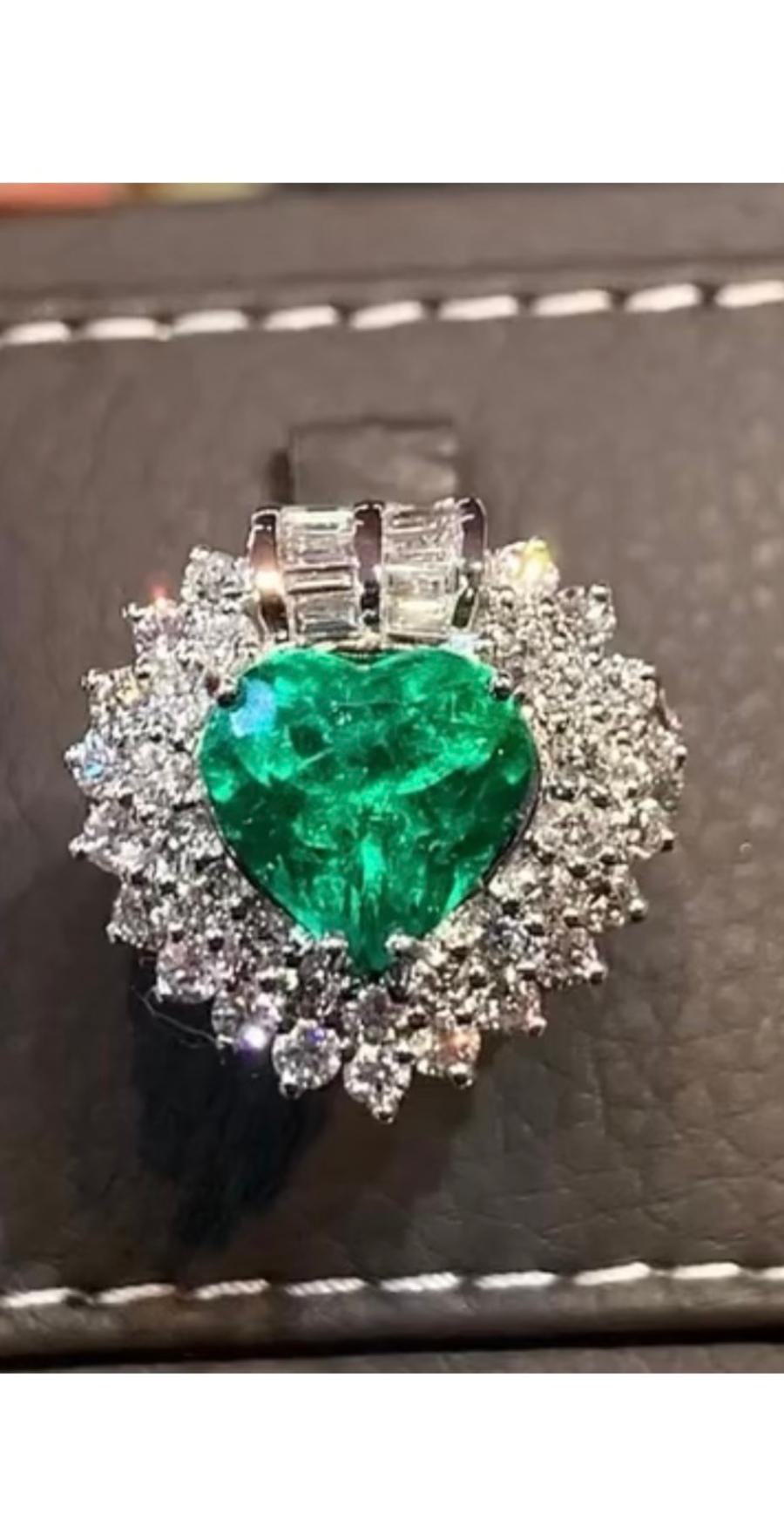 A very adorable and refined design made in Italy, with a fine quality of heart cut Colombia emerald 3,74 ct and round and baguettes cut diamonds of 2 ct F/VS( top quality) . 
Handcrafted by artisan goldsmith.
Excellent manufacture and