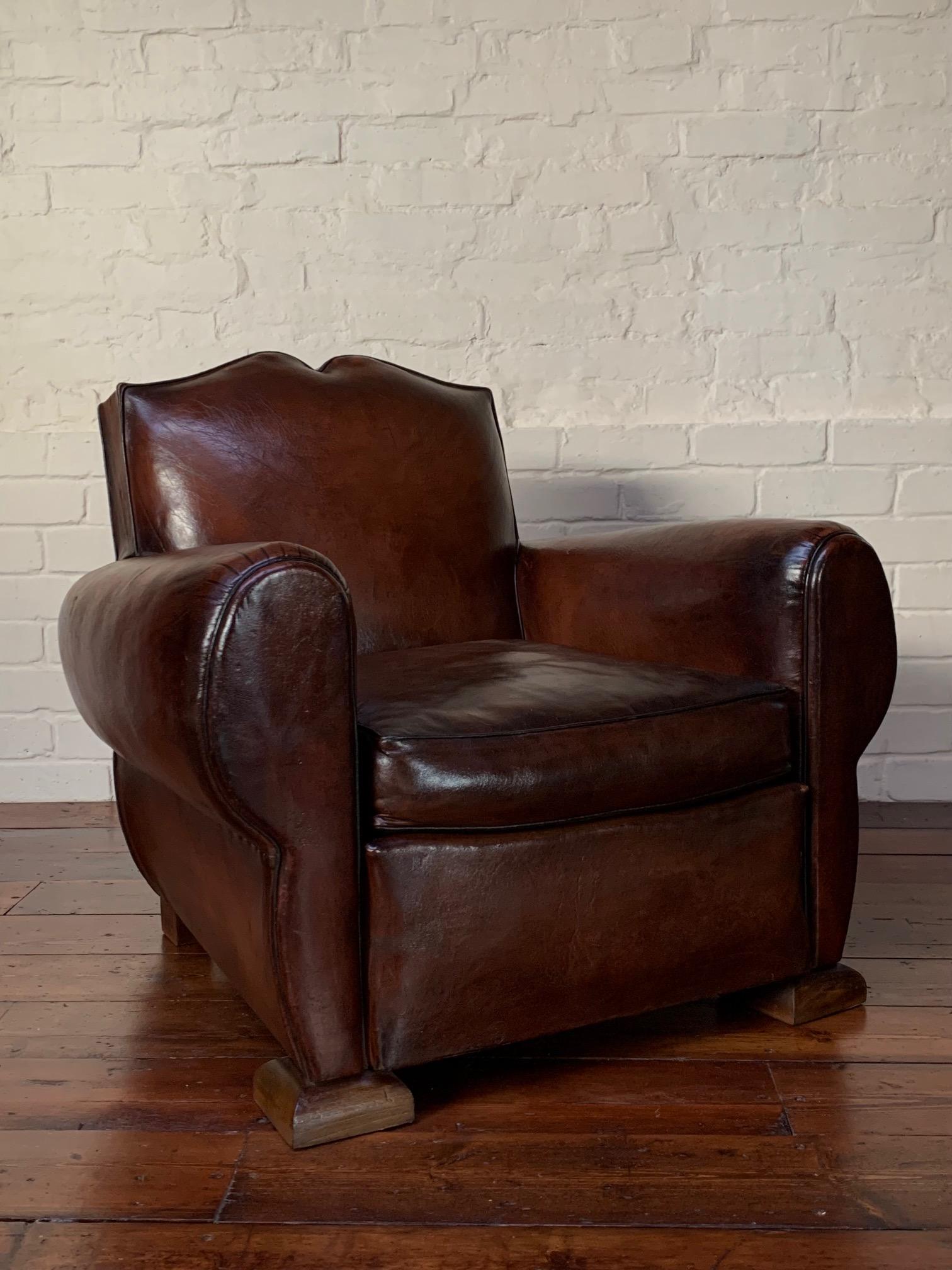 Step back in time and elevate your living space with this exquisite 1940's French leather club chair. Impeccably preserved and meticulously cared for, it exudes vintage charm. The original Havana brown leather has matured over the decades, creating