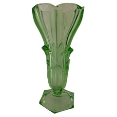 An exquisite green uranium glass vase with a captivating flower design