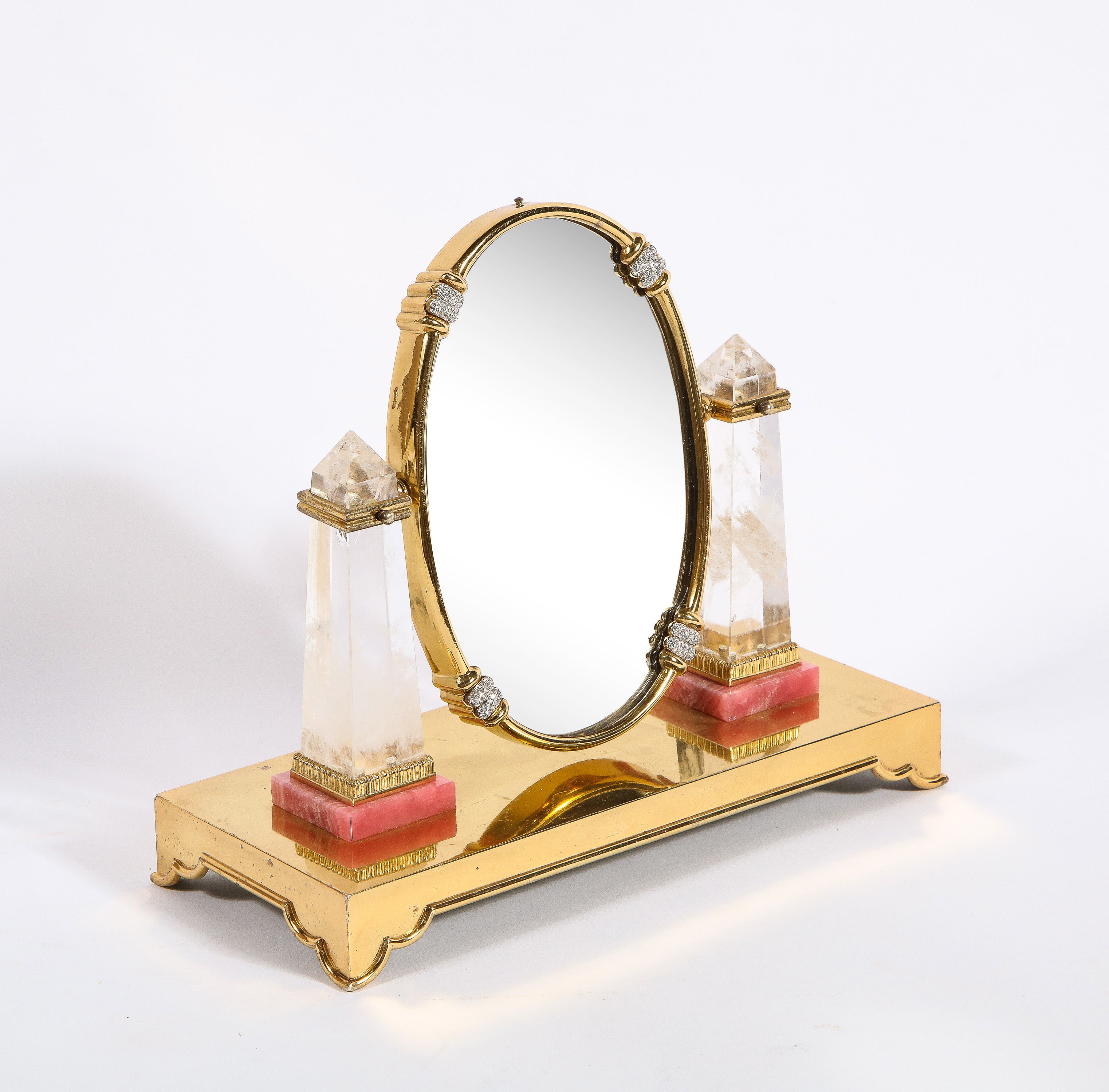 An Exquisite Italian Silver-Gilt, Diamond, Rock Crystal, and Rhodochrosite Vanity Mirror, by Moba Italy.

Circa 1950

Very fine and impressive vanity mirror made in solid sterling gilt, with two rock crystal obelisks, mounted to rhodochrosite. 8