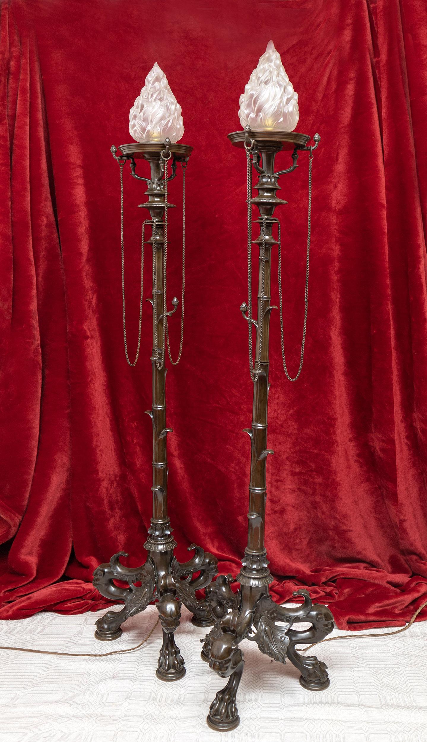 Manufactured in France by the renowned Ferdinand Barbedienne and designed by Henry Cahieux specifically for the iconic 1855 Paris Exposition Universelle. The stands with deep brown patina and suspended chains are finely cast with lost-wax bronze and