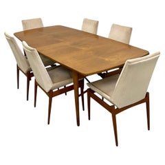 An Extending Hamilton Rosewood Dining Table & Ten Chairs By Robert Heritage