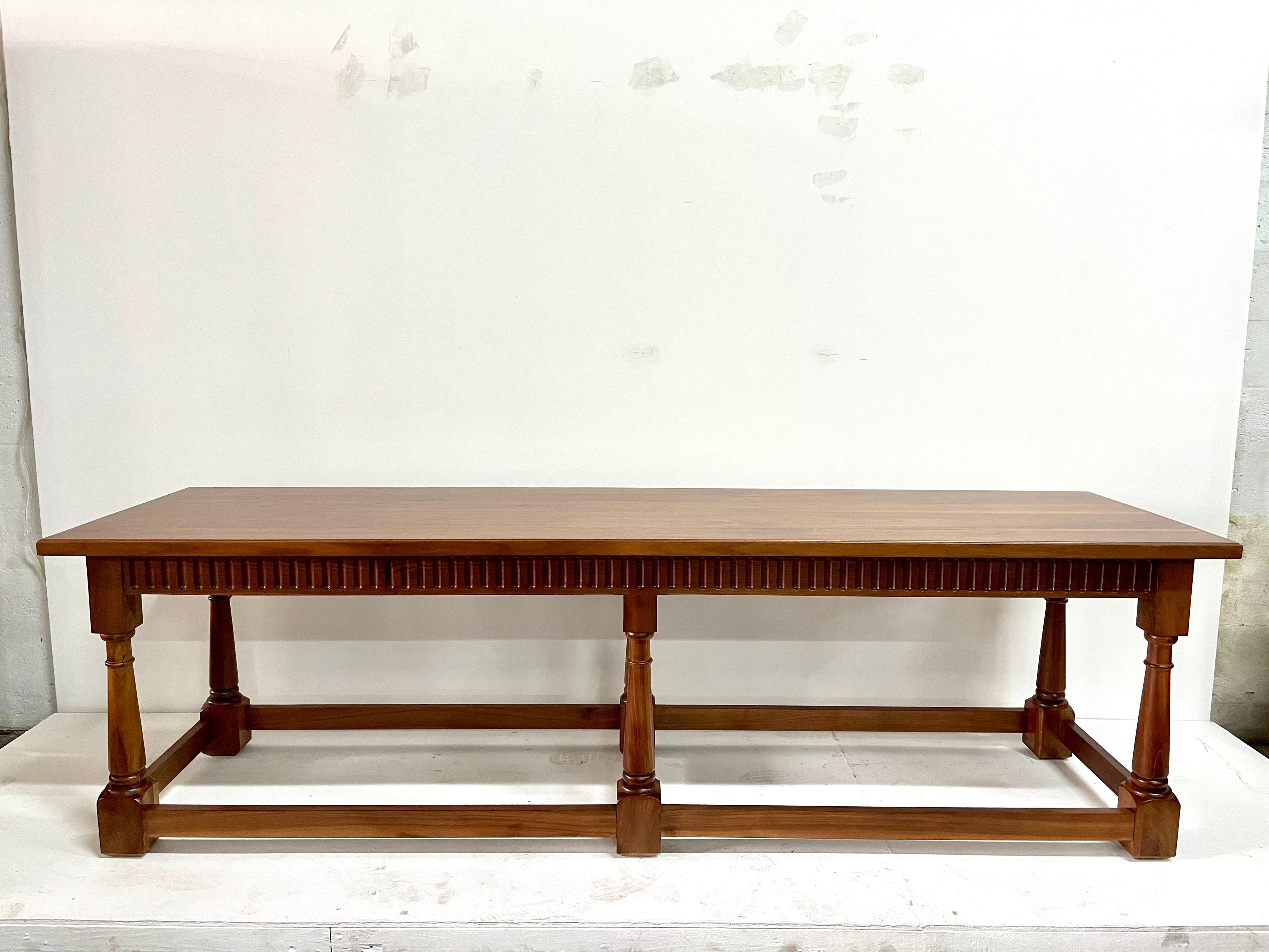 This truly important long table with carved wood stretchers and ribbed trim throughout. In really clean condition and ready to use.

Measures: 102 wide, 28 depth, 30 tall.