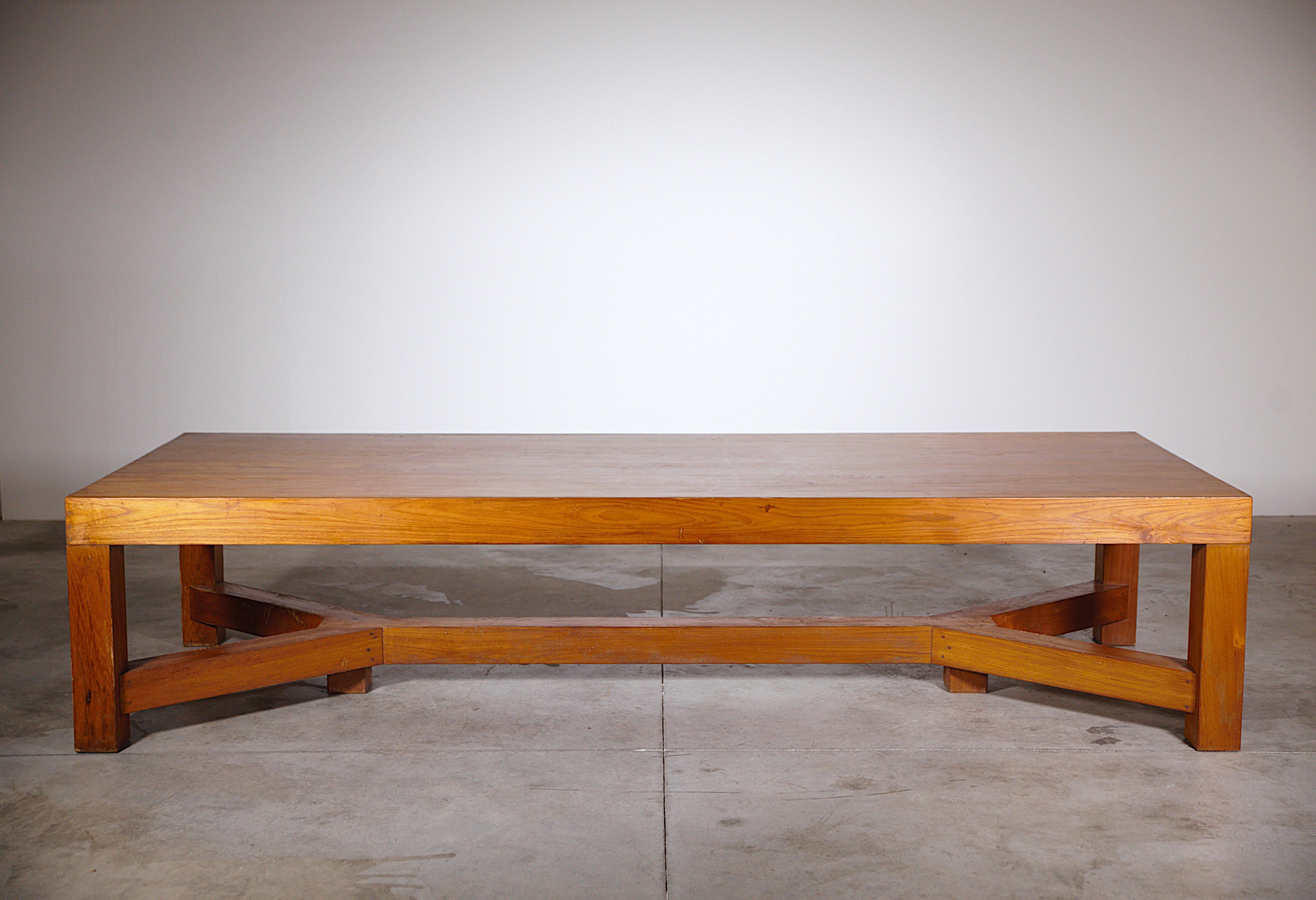 An Extra - Ordinary Dining Table Architect Work's France 1970s.

Massive teck wood.
Beautiful manufacture...simple and effective.

Report : An old restoration in a corner of the top. Scratching  on the table crossbeam. 
The top is in good condition