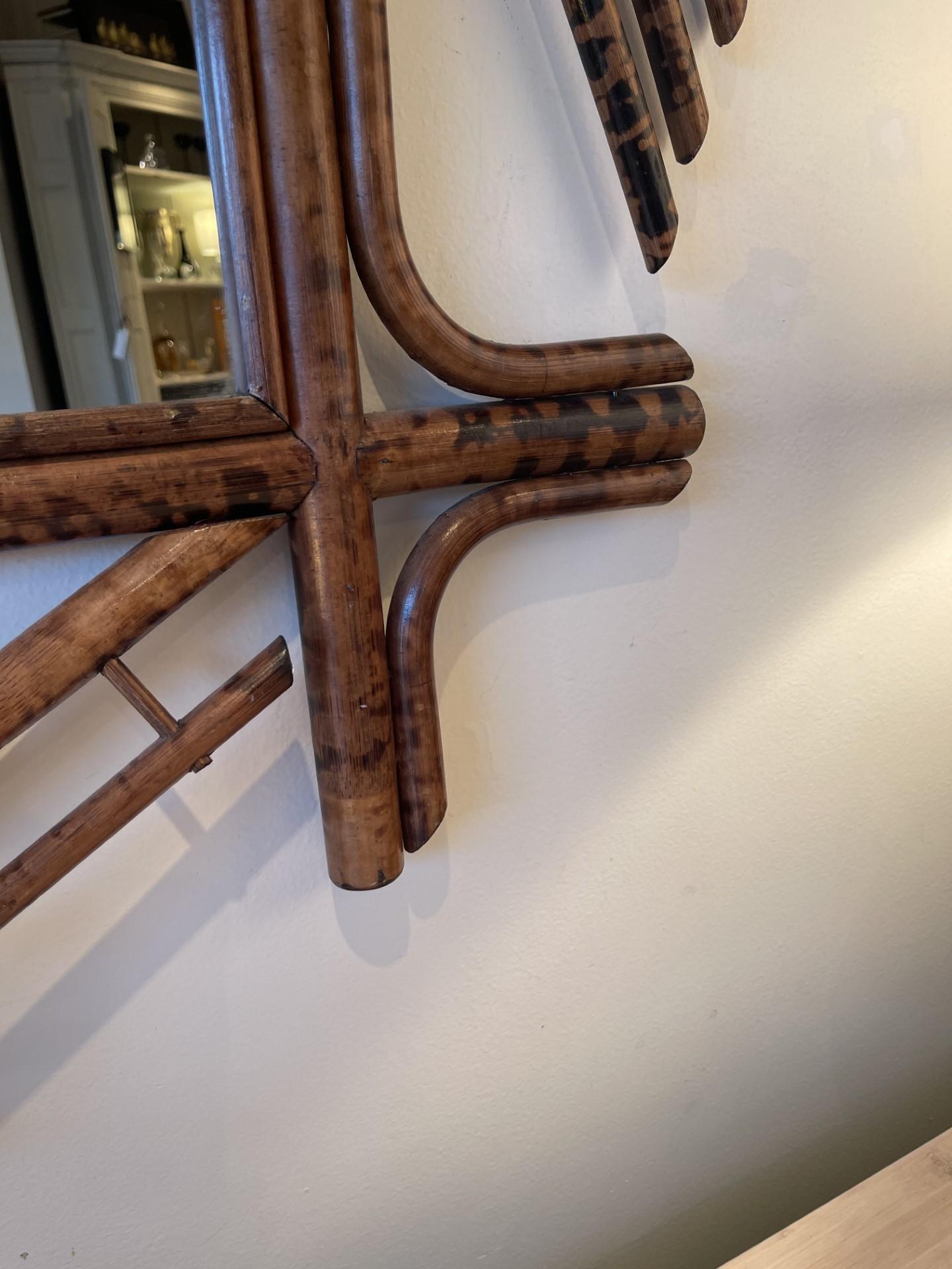 A Rare find in this  exceptional Chinese Chippendale Faux Tortoiseshell  mirror. Easily placed in  most environment's, from modern to traditional , bamboo is timeless and transitional, beautifully textured.
Brought into MA from the UK, this mirror