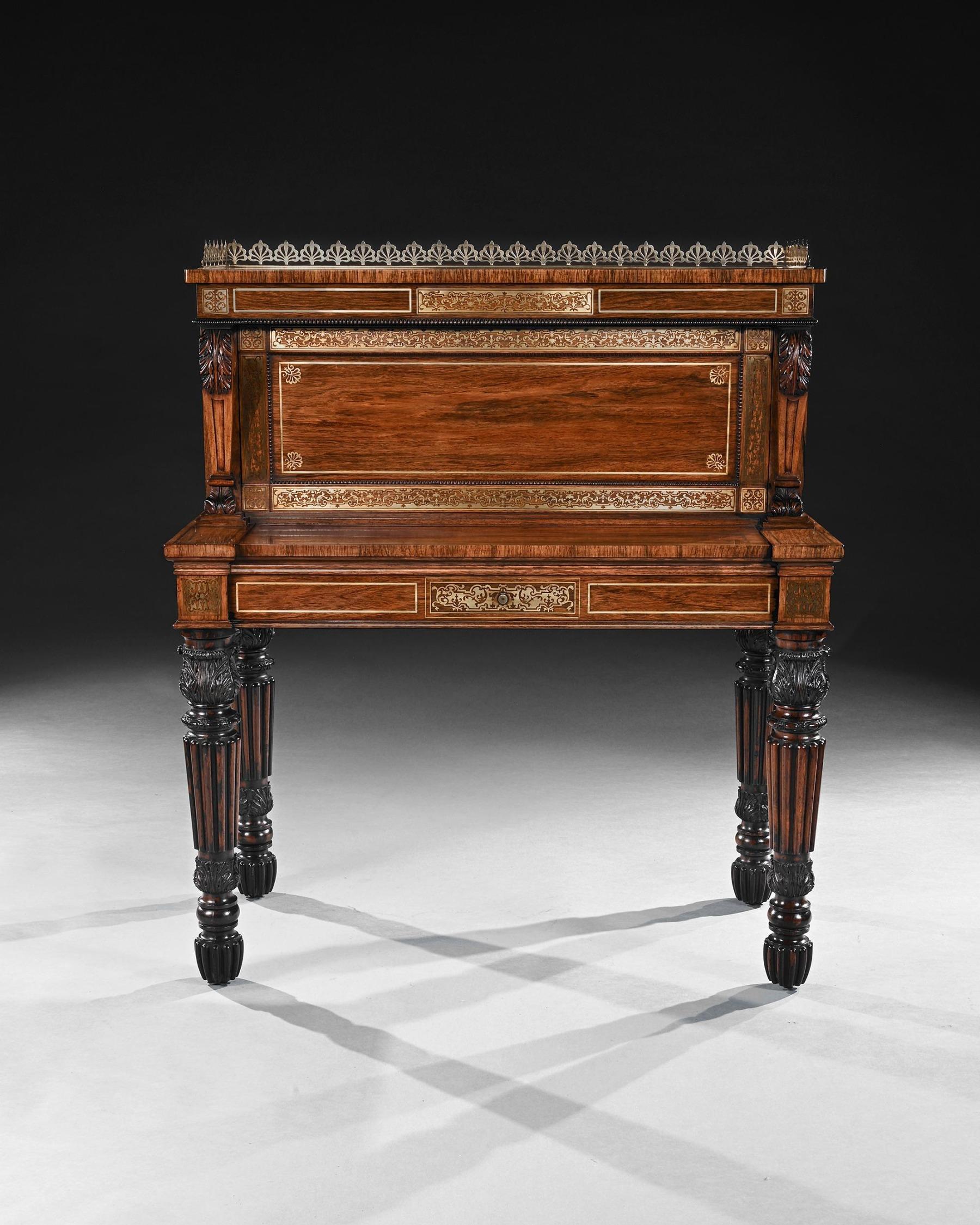 An Extremely Fine and rare Rosewood and Brass Inlaid Writing Table Attributed to the Oxford Street Workshop of Gillows.



English c.1820-1830



With a raised back comprising a three quarter pierced anthemion brass gallery above a panelled front