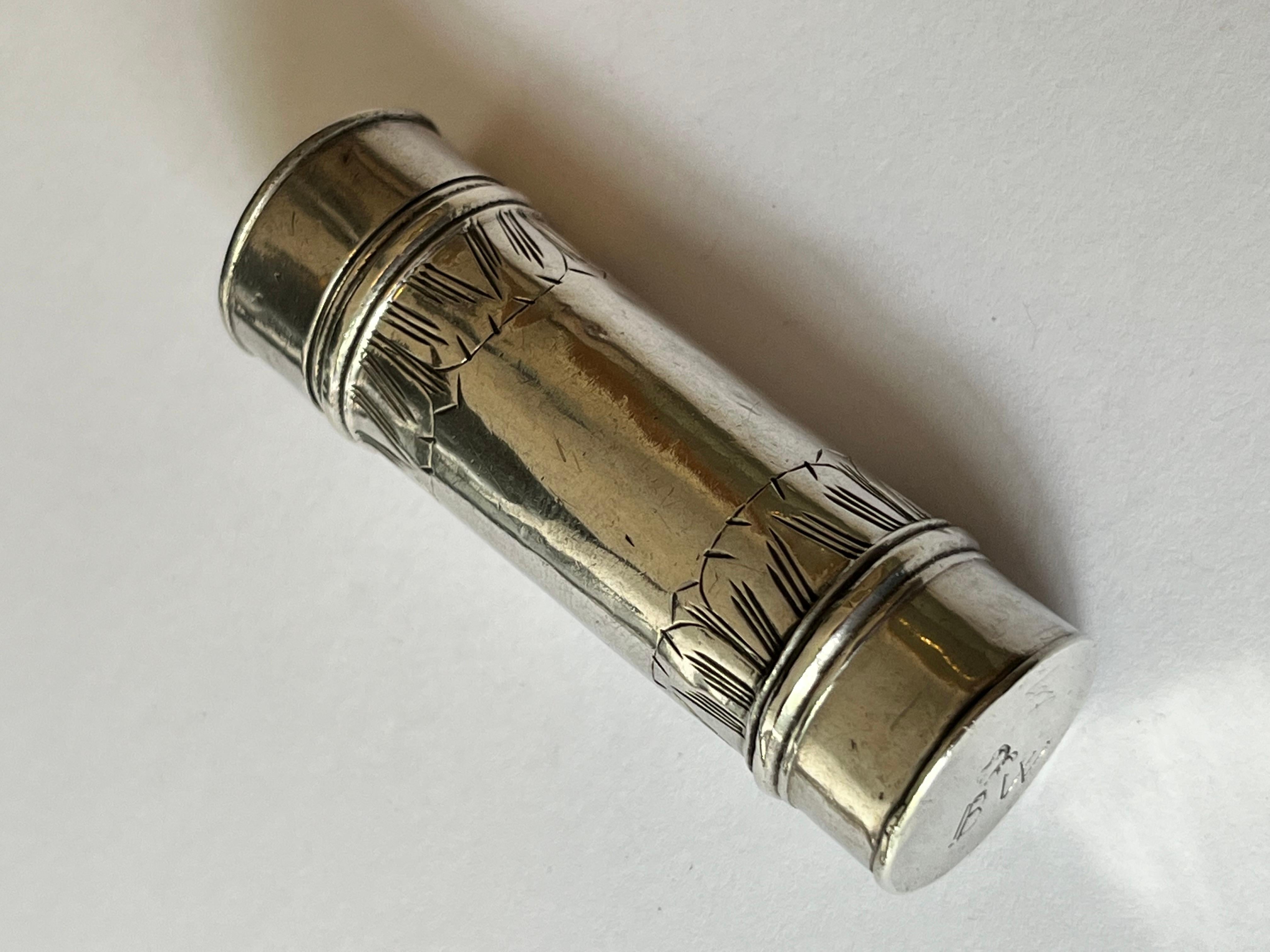 Seventeenth Century.

 

A William and Mary silver cylindrical nutmeg grater, containing the original silver rasp, the exterior with bands of stylised fooliate decoration, the detachable cap engraved with a tulip. The base and rasp with matching