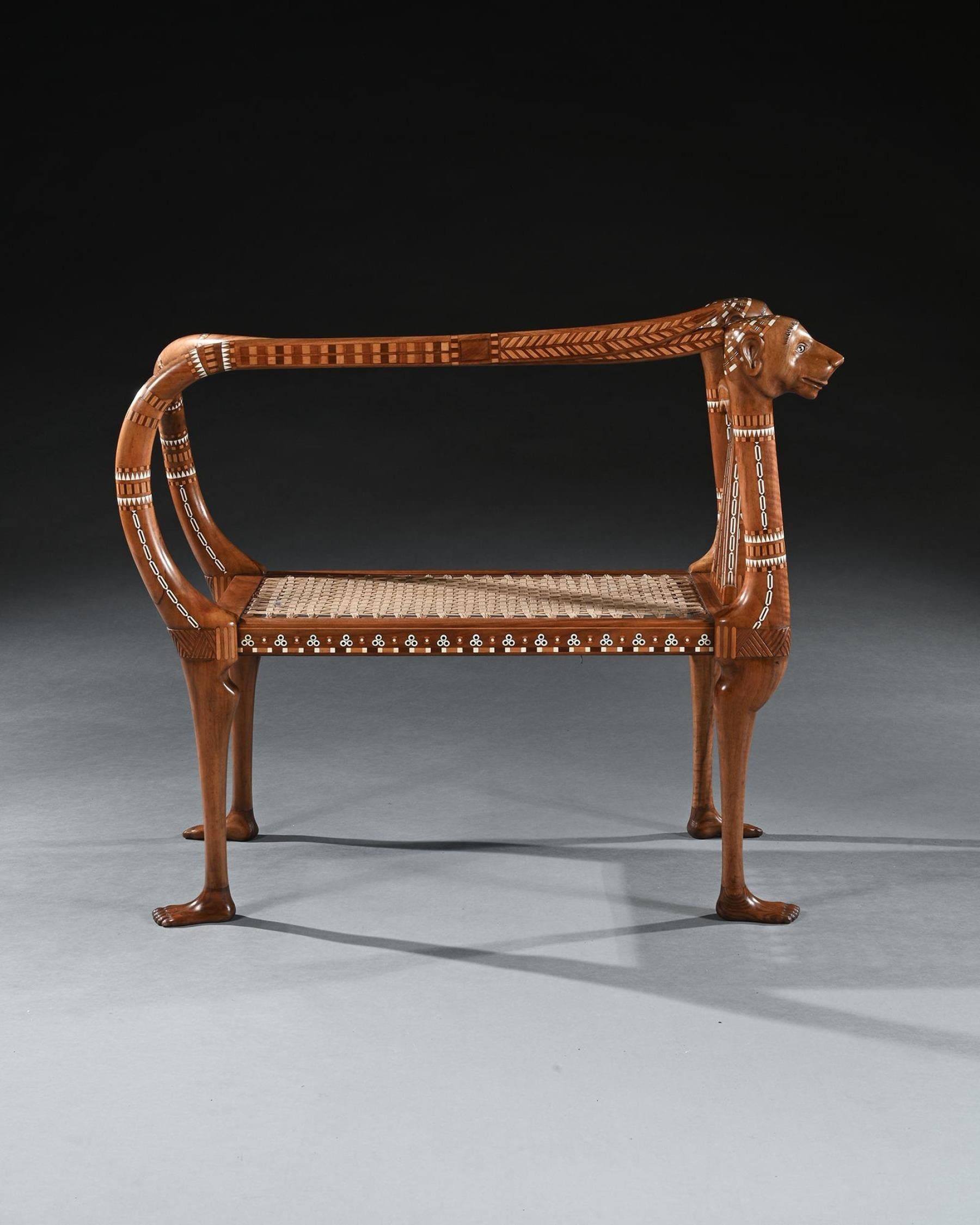 An Extremely Rare and Possibly Unique Walnut and Inlaid Egyptian Revival Bench or Window Seat

French Circa - 1922-25

Of exhibition quality, made from solid walnut and profusely inlaid with geometric tesserae including bone and ivory, along with