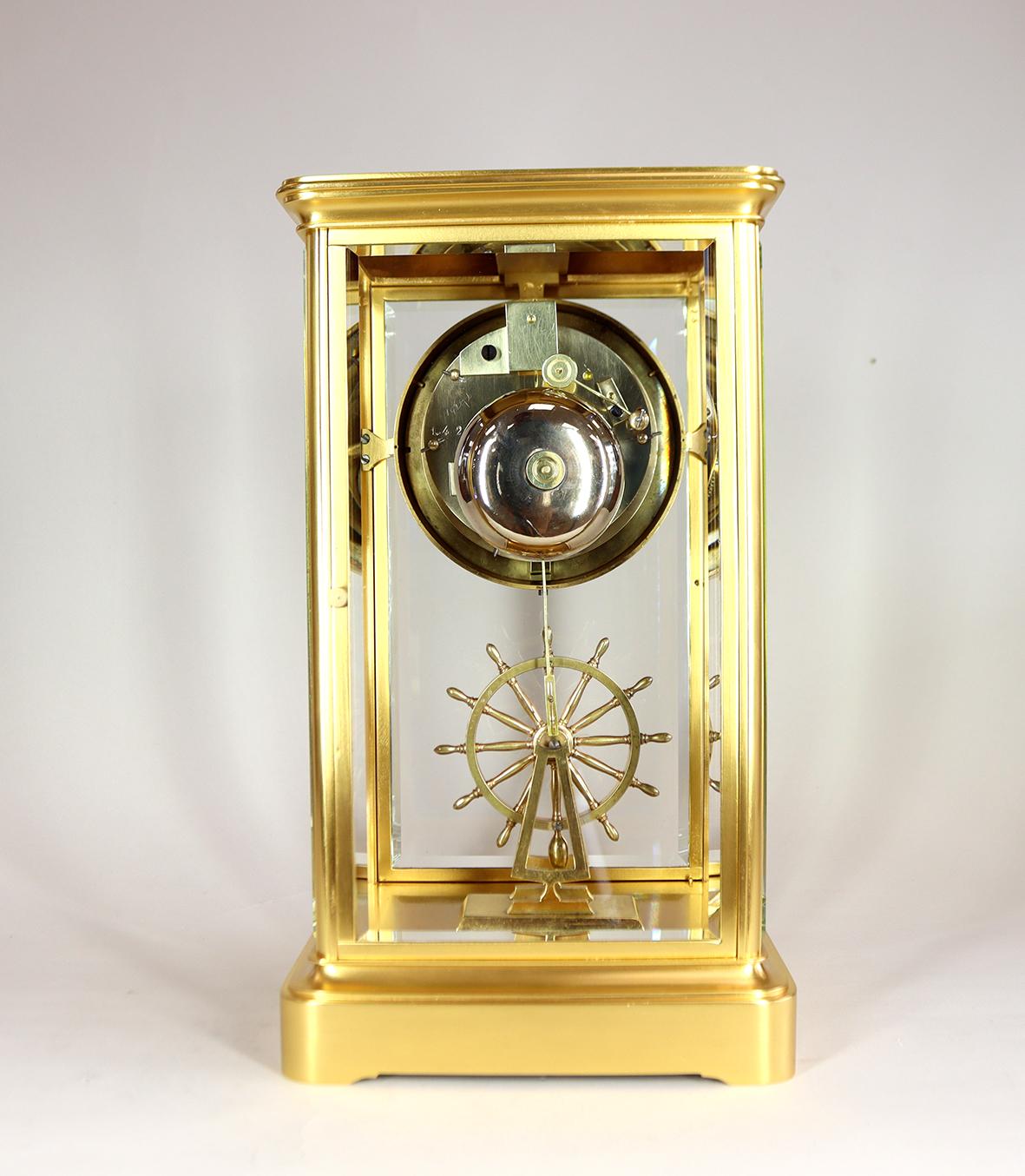 Enameled An Extremely Rare Ships Wheel Pendulum Four Glass Clock For Sale