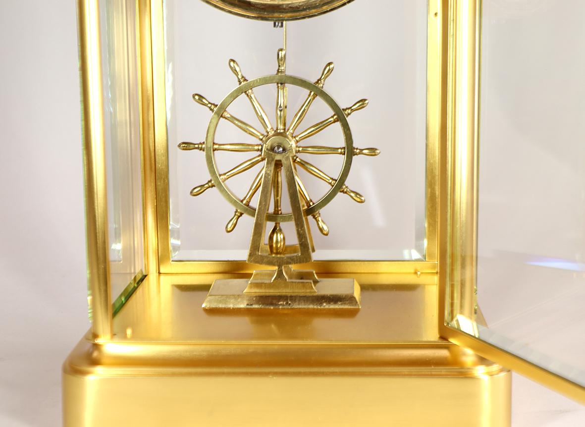 Brass An Extremely Rare Ships Wheel Pendulum Four Glass Clock For Sale