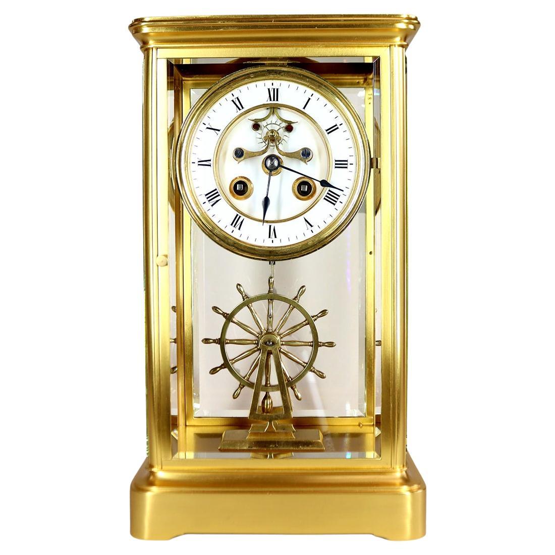 An Extremely Rare Ships Wheel Pendulum Four Glass Clock
