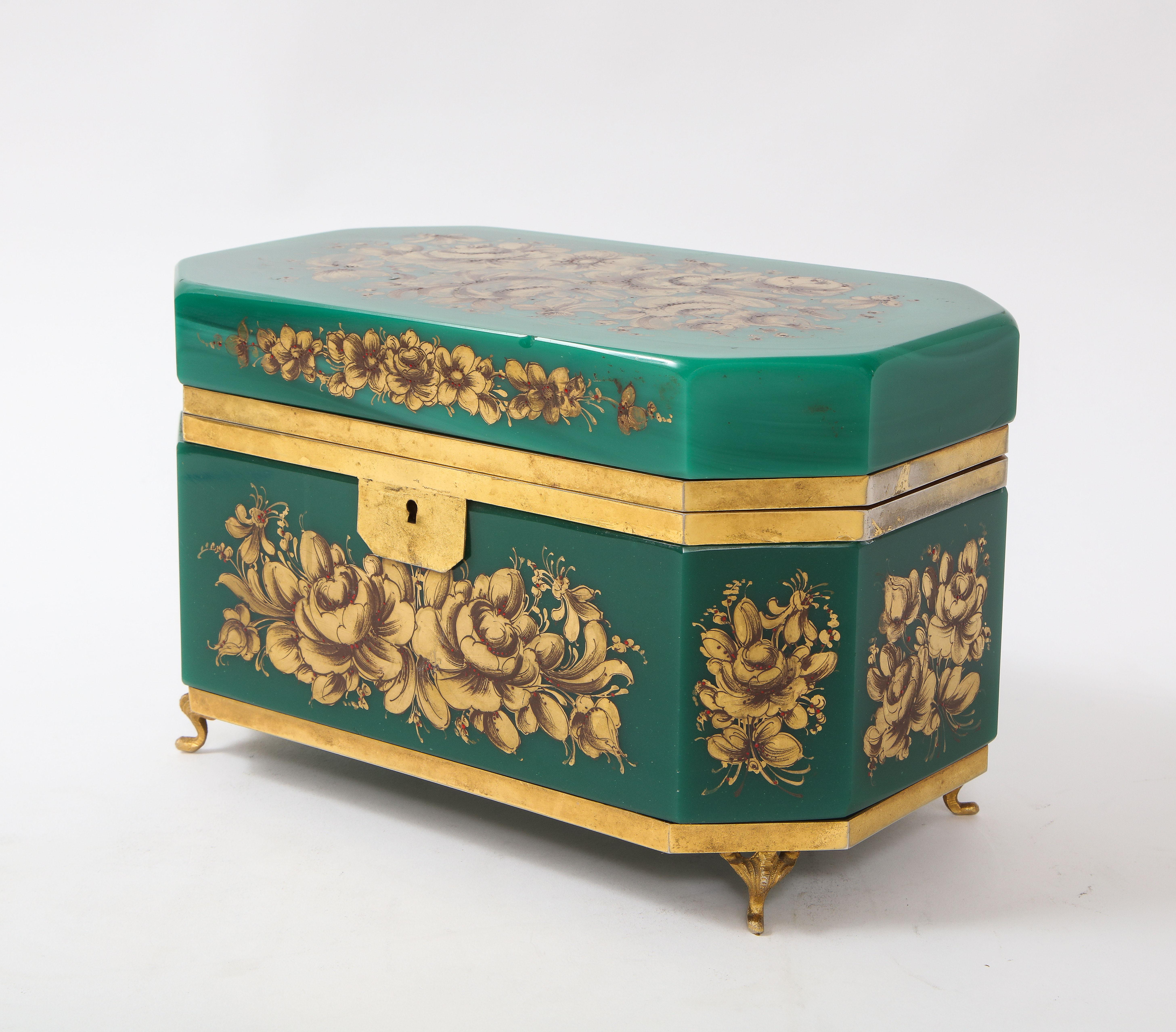 An extremely large 19th century Louis XVI Style French doré bonze mounted green spinach jade color opalescent opaline and doré bronze mounted jewelry box adorned with raised 24-karat gold décor. This box is truly amazing in both size and appearance.