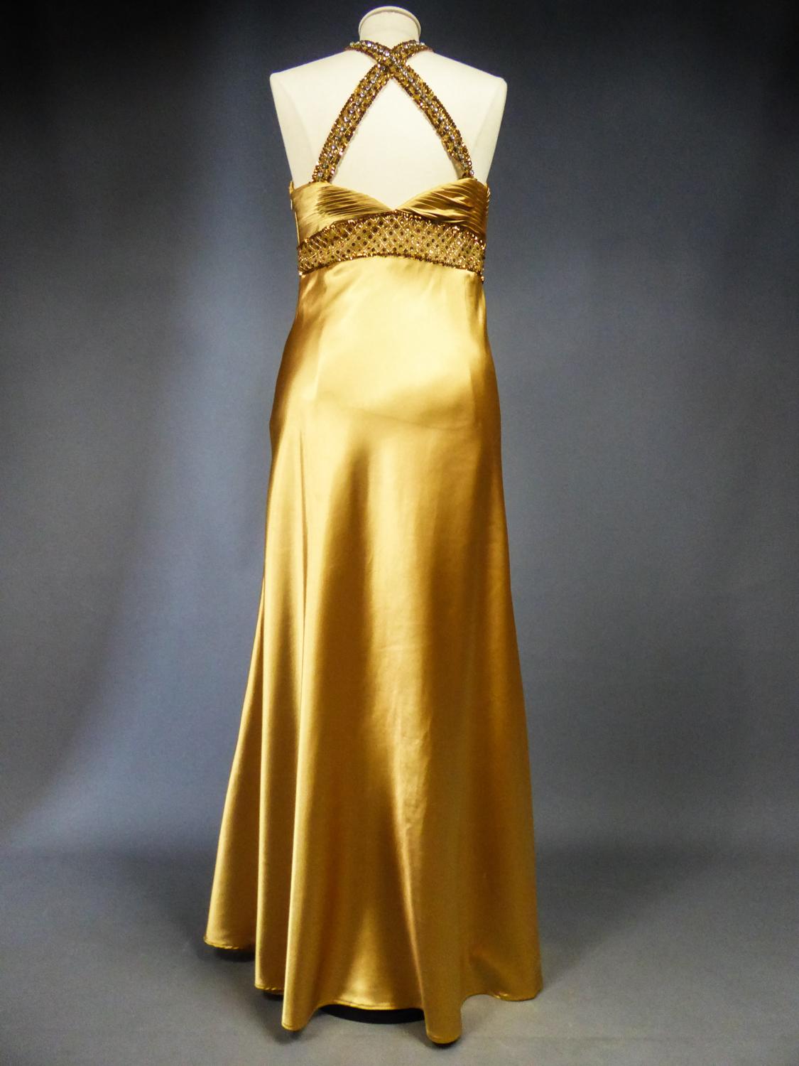 An French Evening Gown in Gold Embroidered Satin with Sequins Circa 1980 3
