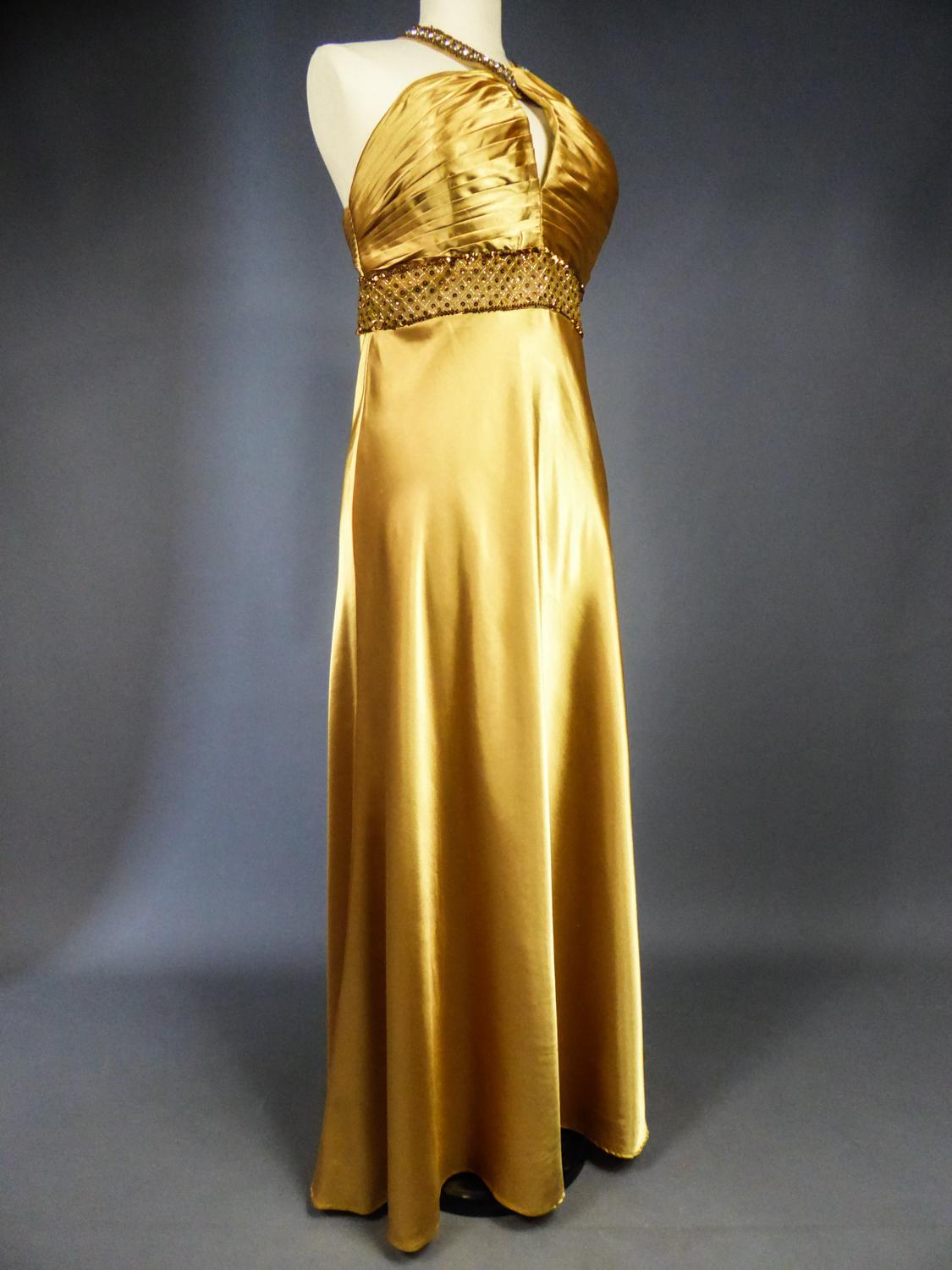 Women's An French Evening Gown in Gold Embroidered Satin with Sequins Circa 1980