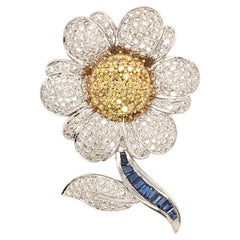 An Gold, Diamond and Sapphire Flower Brooch.
