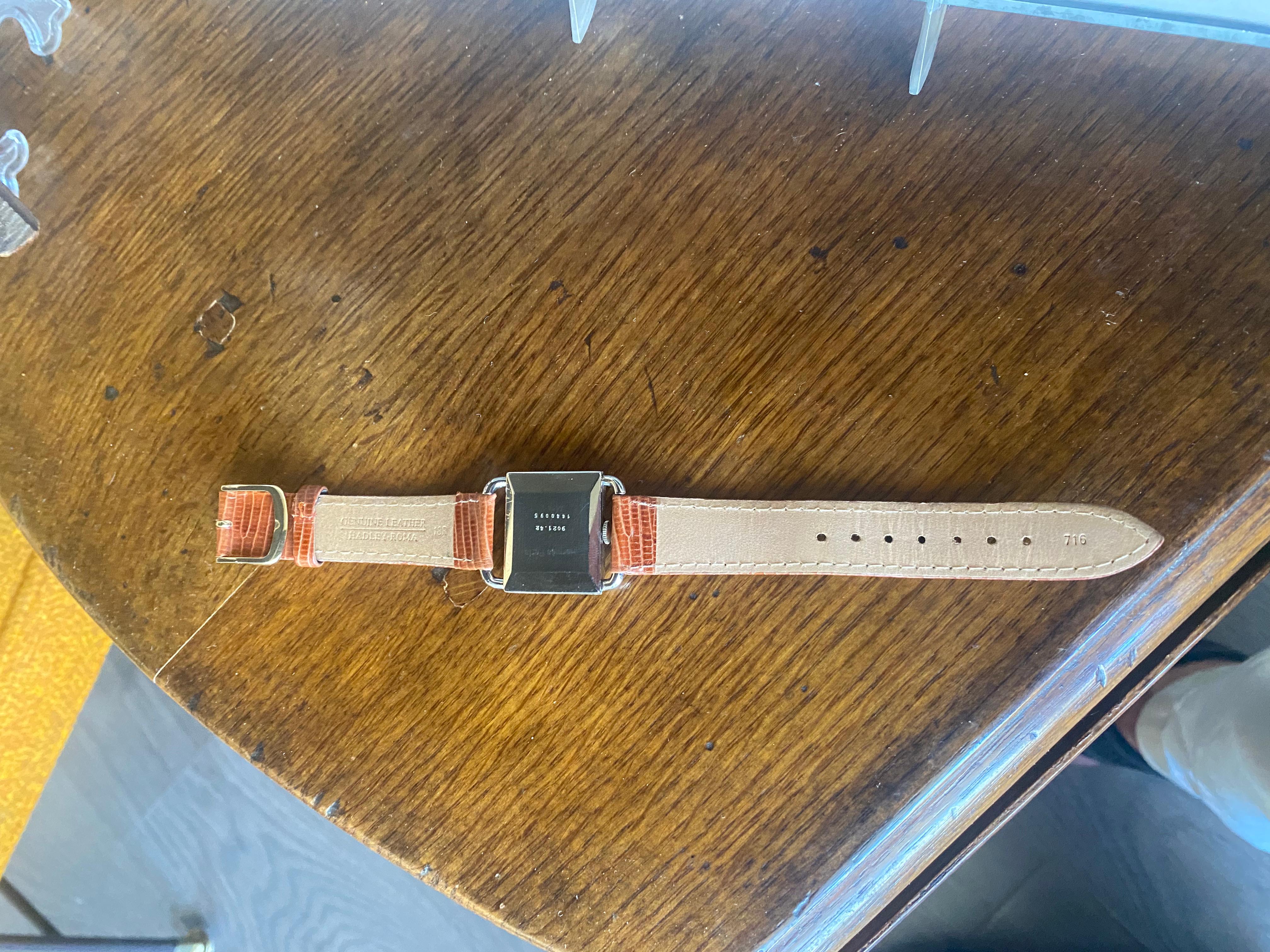 Eine Hermes-Uhr mit Lizzardband. (20. Jahrhundert) im Angebot
