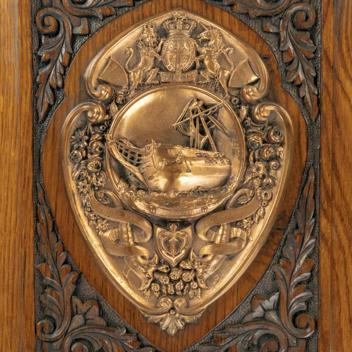 An H.M.S. Foudroyant copper shield, the embossed copper plaque with the coat of arms of Great Britain flanked by two shields, reading ‘Launched Plymouth 1789’ and ‘Wrecked Blackpool 1897’ above a central roundel showing the bow of the famous
