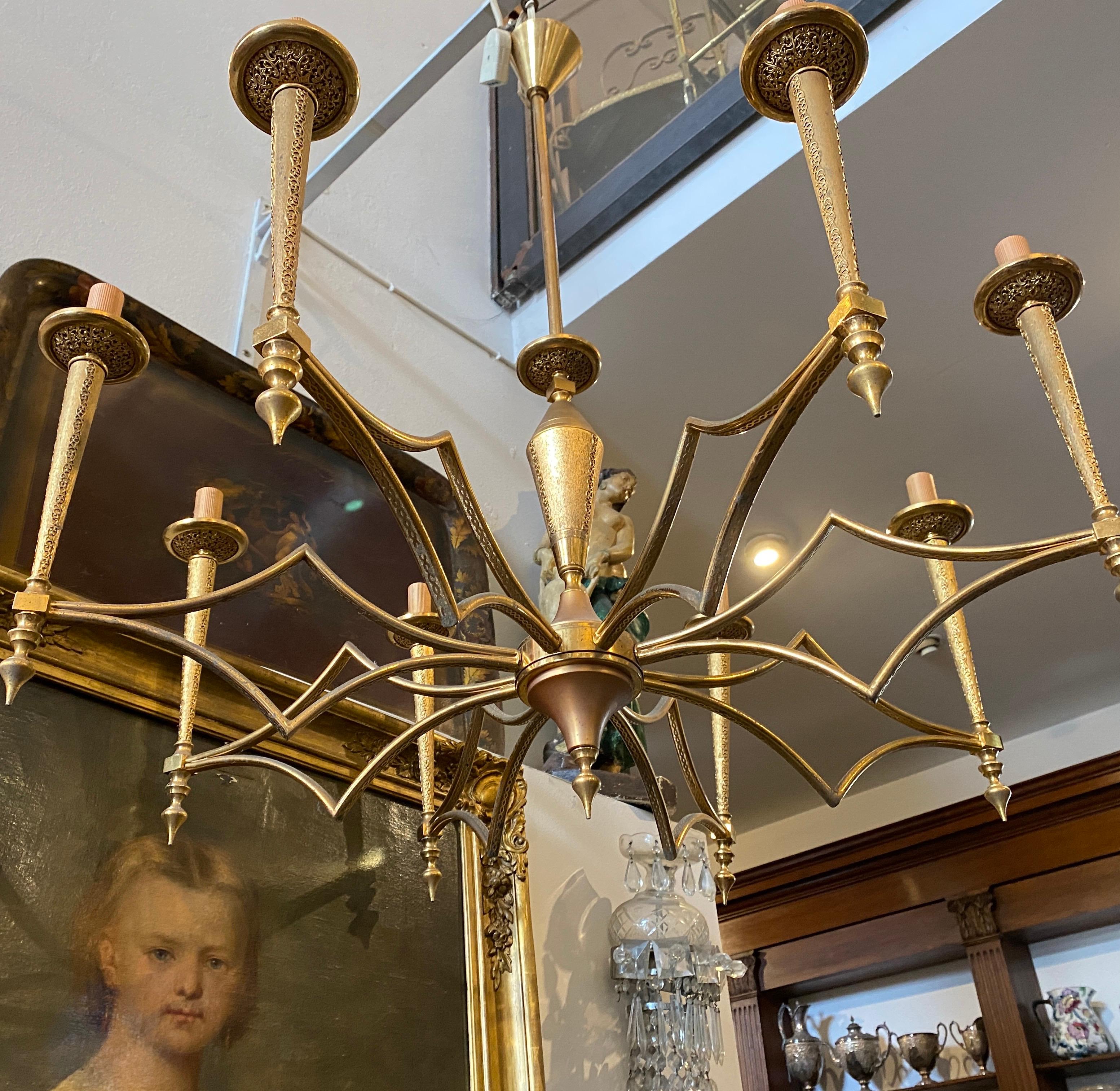 A rare solid brass chandelier made in Italy in the 1950s by F.I.L.C. Milano famous lighting factory, also well known for its collaboration with Guglielmo Ulrich, chandelier is in original patina and in perfect conditions, it works both 110-240 volts