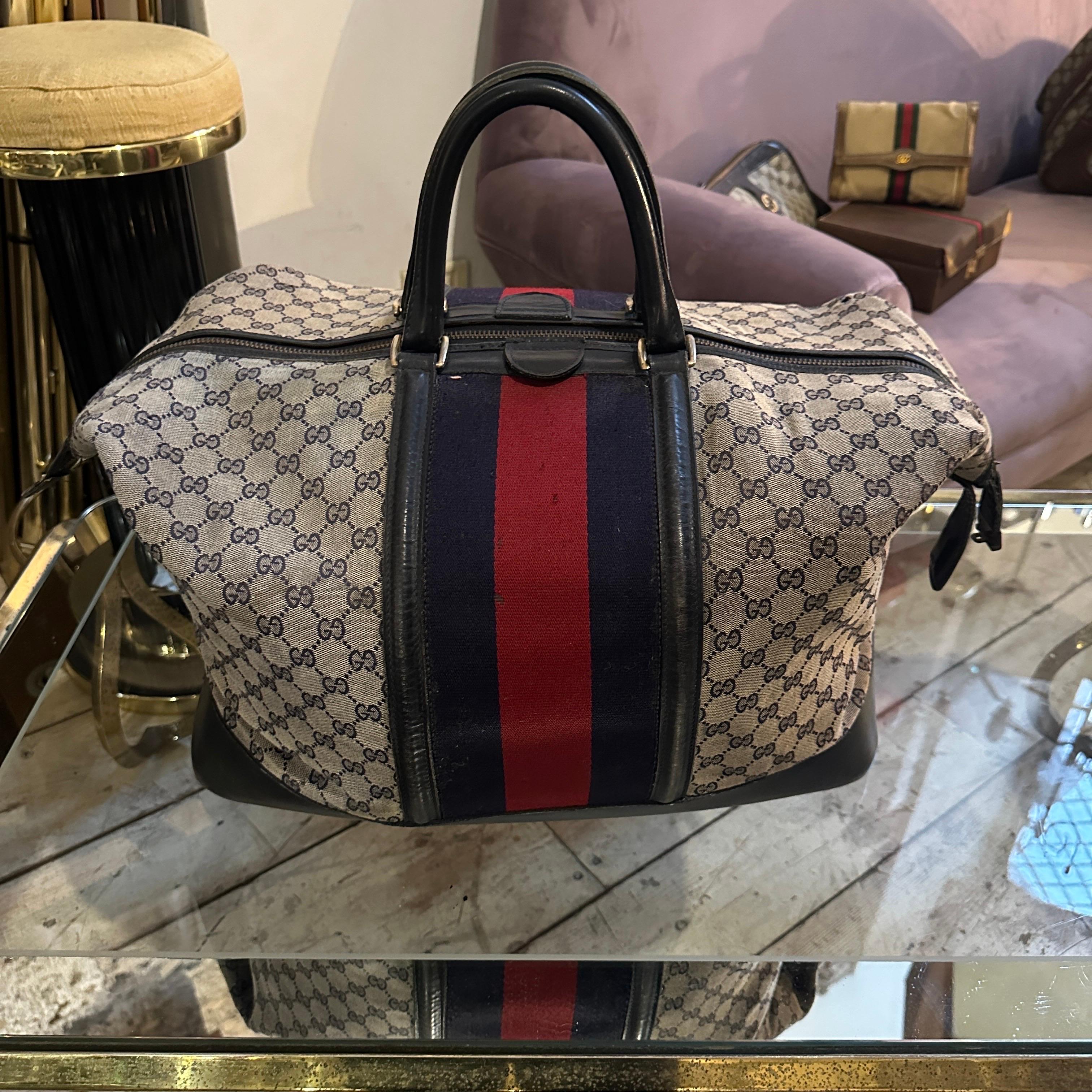 This vintage 1980s Gucci travel bag is a stunning example of the brand’s enduring elegance and commitment to quality, encapsulating the essence of Gucci’s design legacy during that era. Crafted from Gucci’s signature GG monogram canvas, this bag