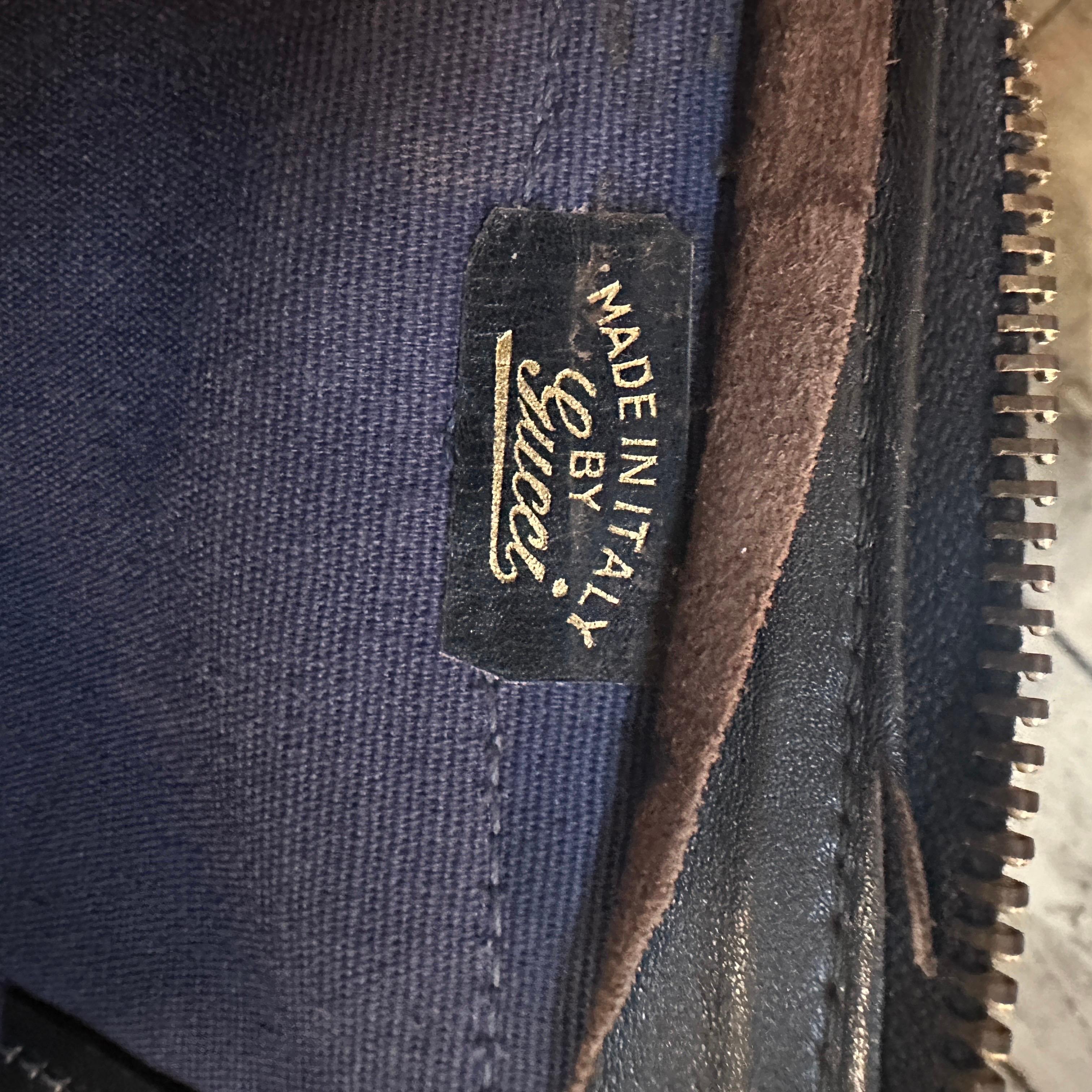 Black An Iconic 1980s Gucci Monogram Travel Bag with Signature Red and Blue Web Stripe