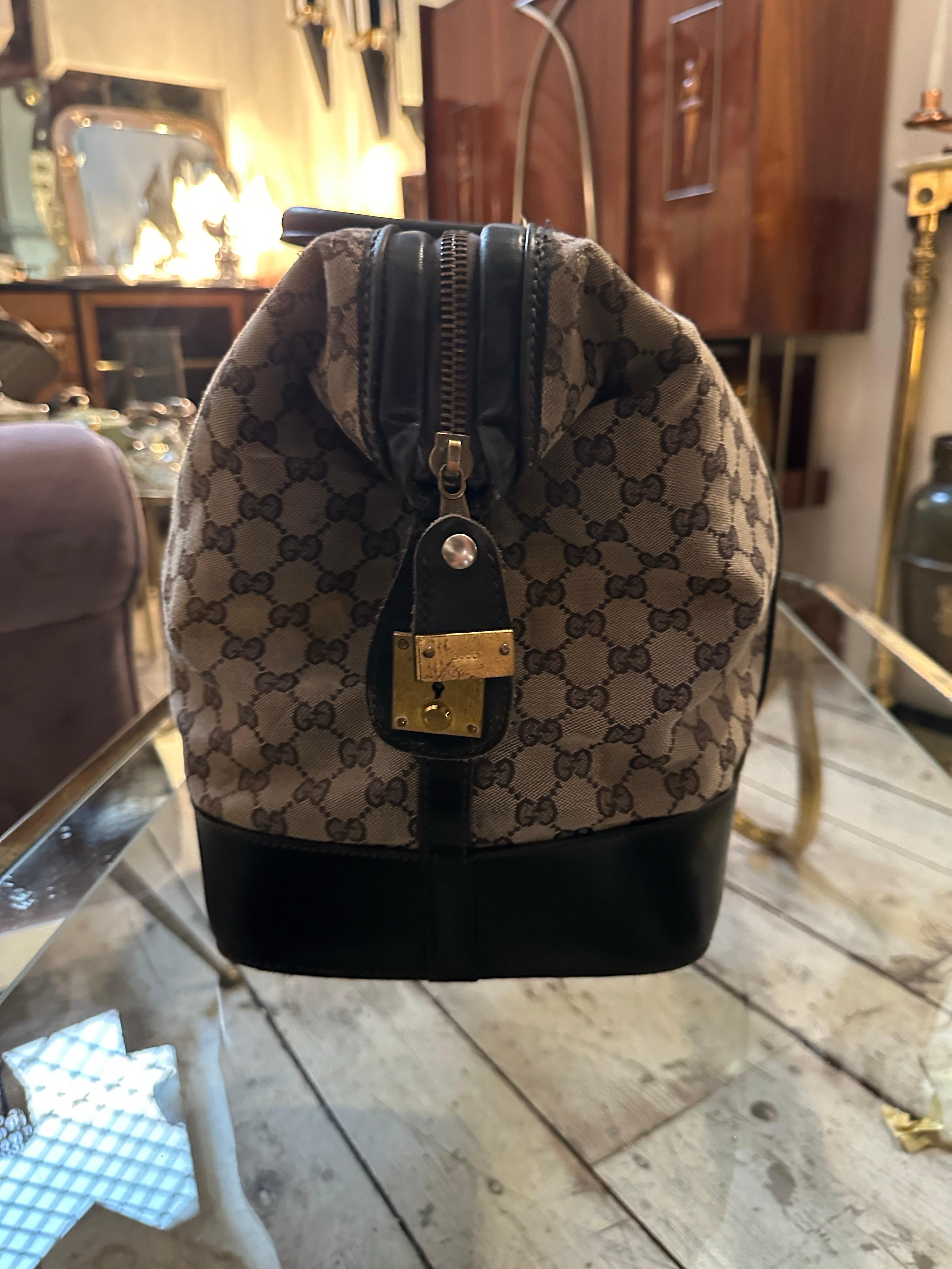 An Iconic 1980s Gucci Monogram Travel Bag with Signature Red and Blue Web Stripe In Good Condition In Aci Castello, IT